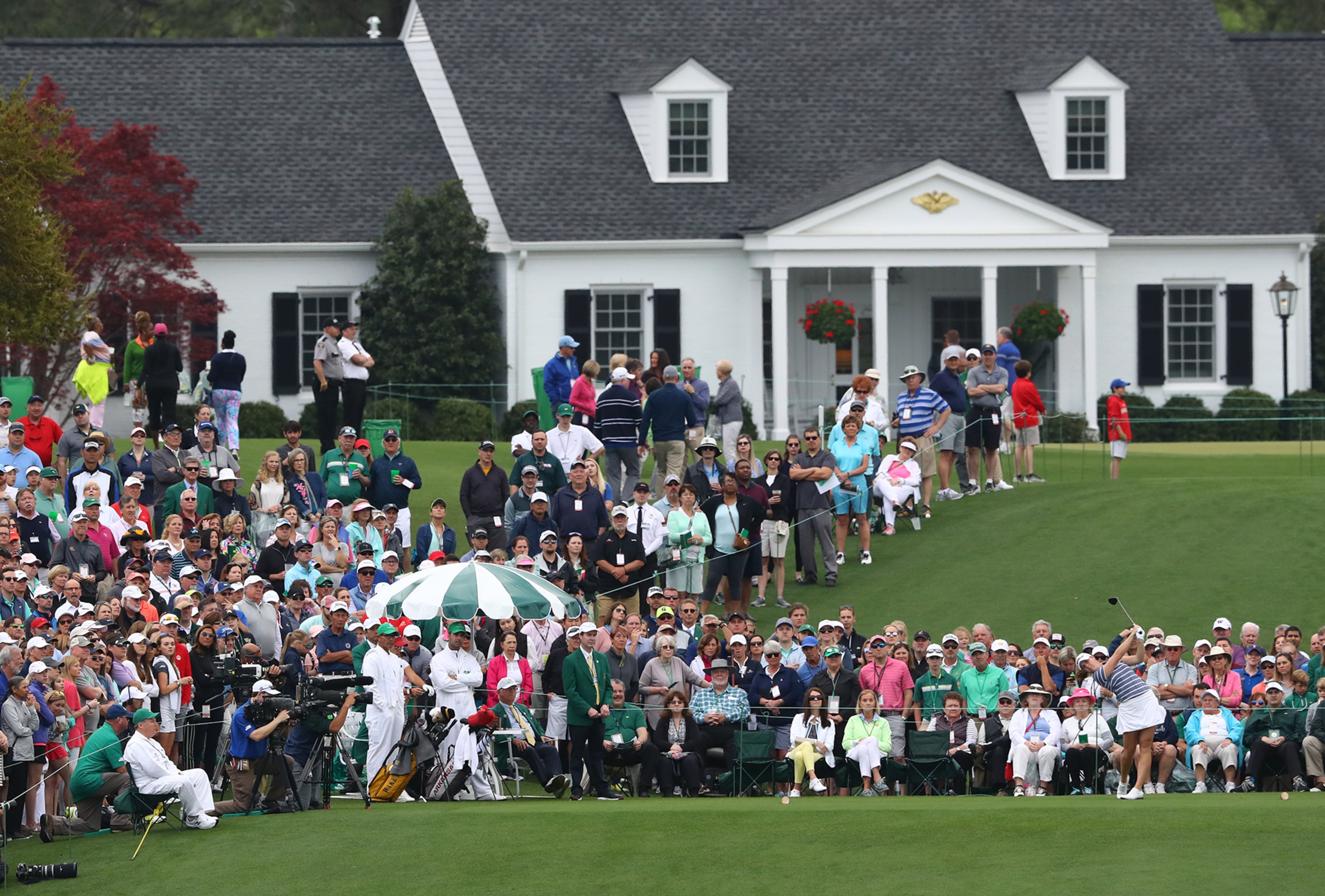 The gallery surrounds the first tee as Jennifer Kupcho tees off on her way to winning the inaugural Augusta National Women's Amateur at Augusta National Golf Club on Saturday, April 6, 2019, in Augusta. Curtis Compton/ccompton@ajc.com