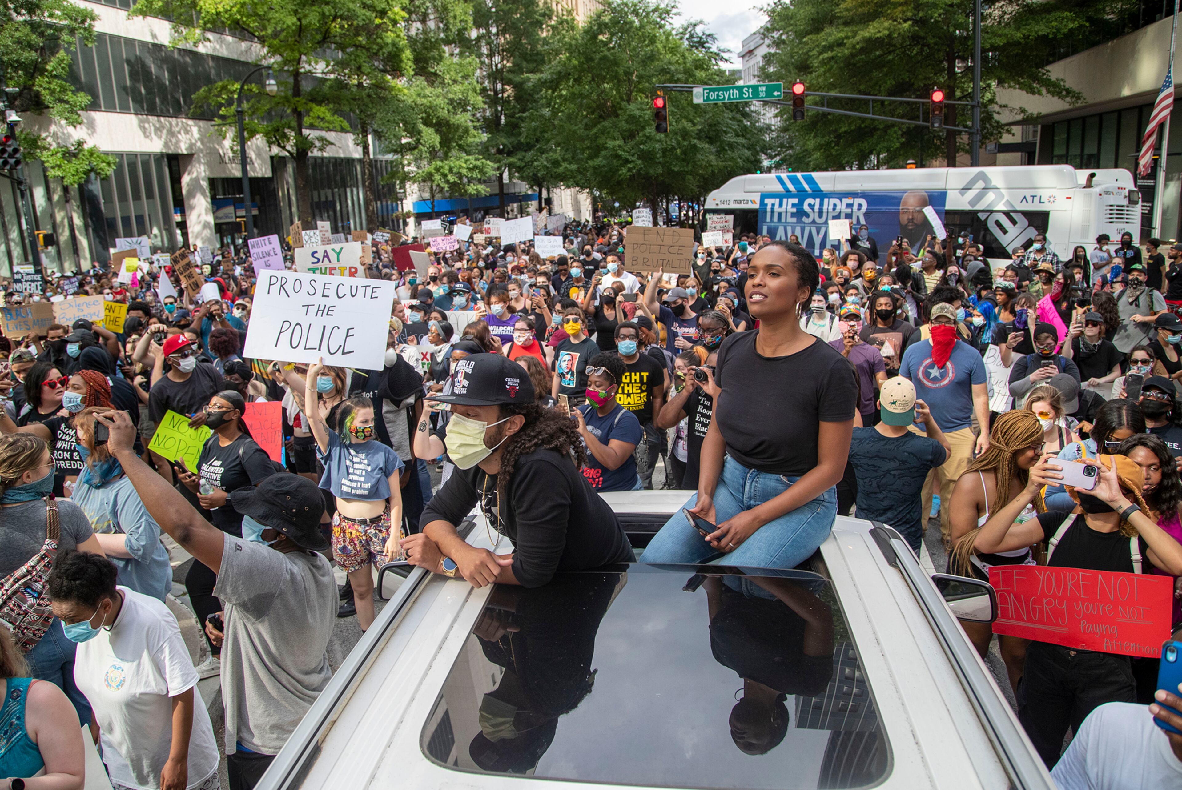 05/29/2020 - Atlanta, Georgia - Josh and Angelica Bias protest from their car during a protest in Atlanta, Friday, May 29, 2020. (ALYSSA POINTER / ALYSSA.POINTER@AJC.COM)