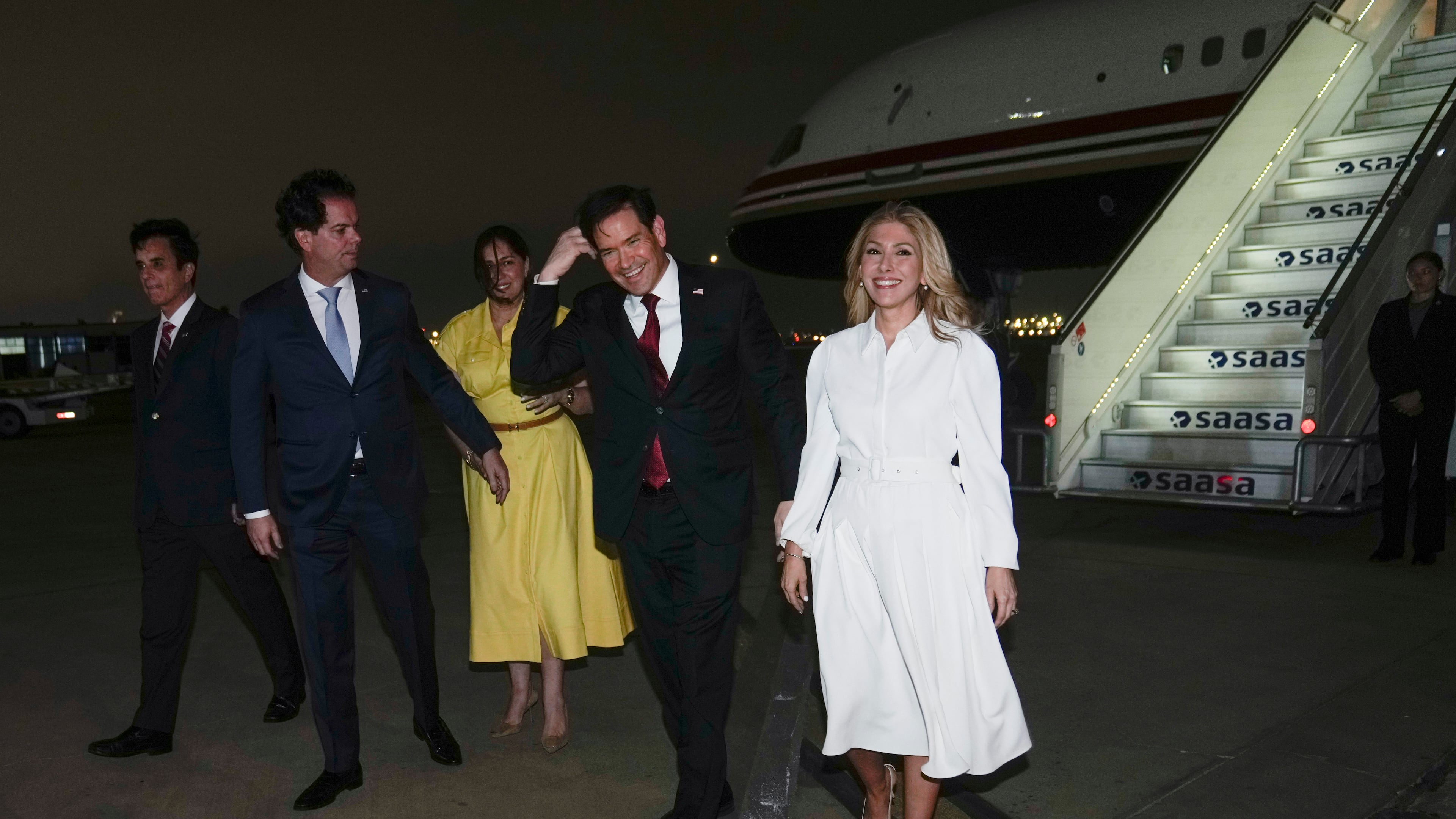U.S. Secretary of State Marco Rubio, second right, and his wife Jeanette Rubio, right, deplane at a military base in Lima, Peru, Wednesday, Sept. 9, 2026. (AP Photo/Martin Mejia, Pool)