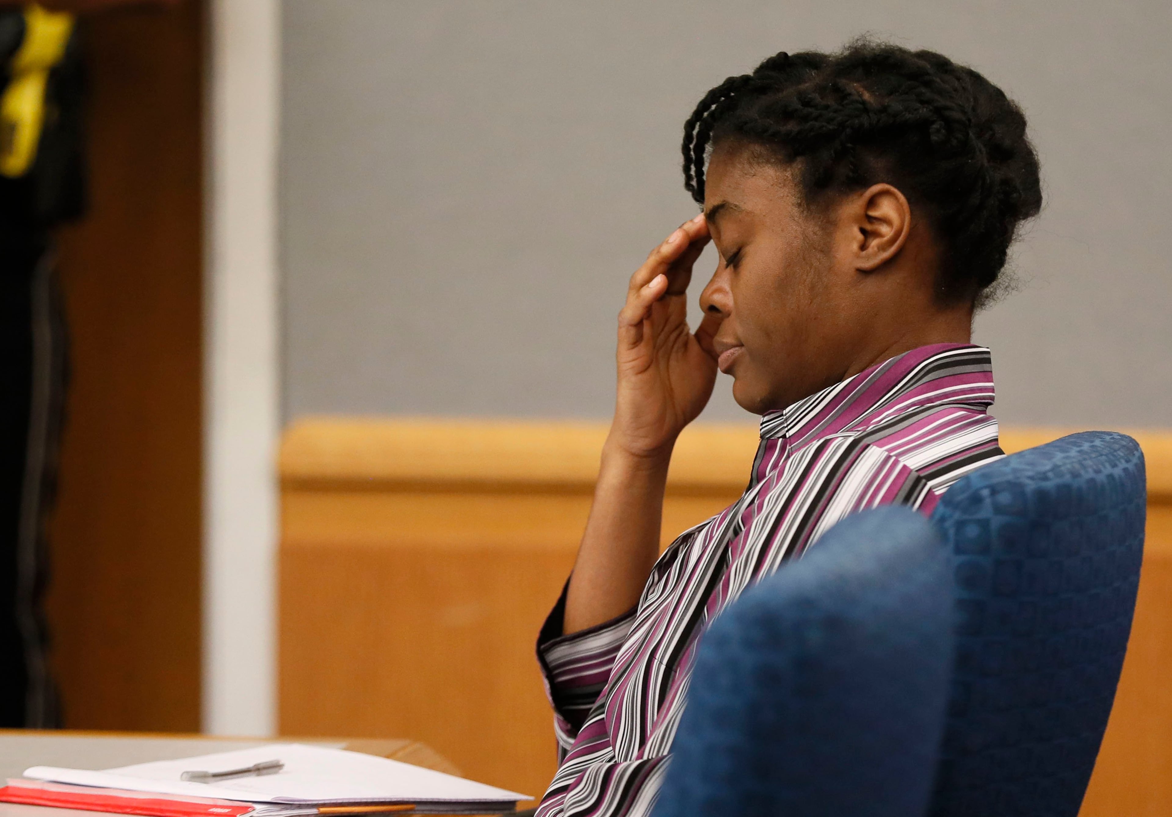 April 25, 2019 - Lawrenceville - Tiffany Moss showed little emotion during the testimony of Emani Moss' father, Eman Moss, at her capital murder trial. . Eman Moss agreed to a plea deal that allowed him t avoid the penalty in exchange for testifying against Tiffany Moss. The prosecution continued for the second day in the Tiffany Moss death penalty trial with the testimony of Eman Moss. Moss, who is representing herself, again declined to ask questions of the prosecution witnesses. Bob Andres / bandres@ajc.com