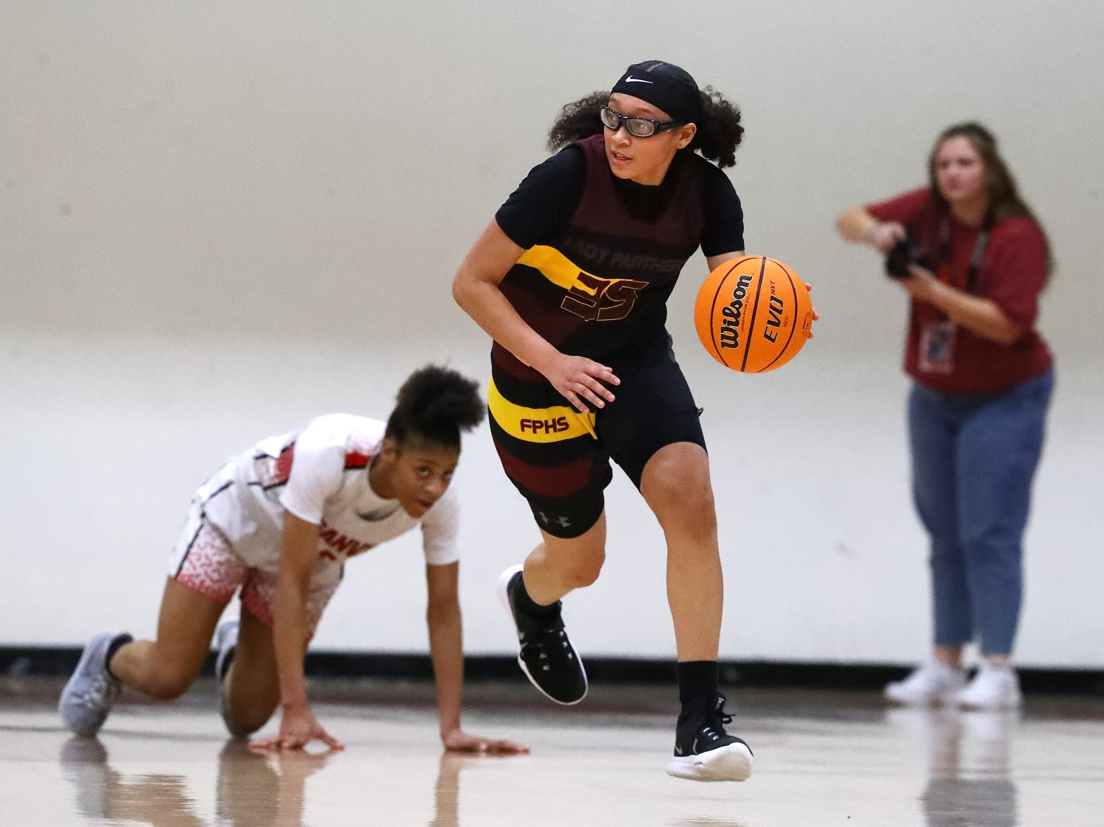 Forest Park guard Yasmine Allen steals from Loganville guard Sydney Bolden on the way to a 52-40 victory over Loganville in their high school basketball tournament game on Wednesday, March 2, 2022, in Loganville. “Curtis Compton / Curtis.Compton@ajc.com”`