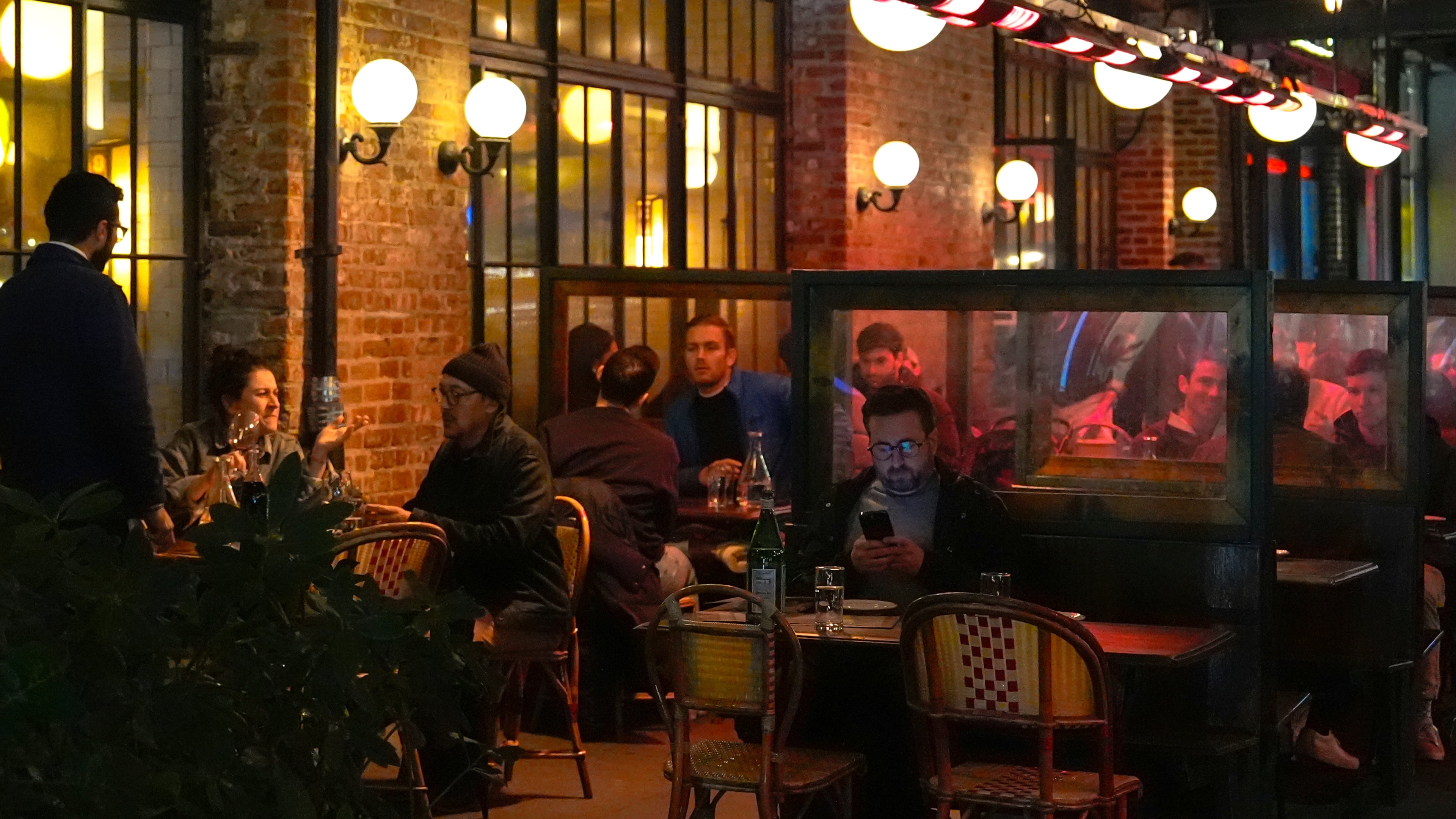 FILE - Diners eat at a restaurant in the Meatpacking District of Manhattan, Nov. 22, 2024, in New York. (AP Photo/Julia Demaree Nikhinson, File)