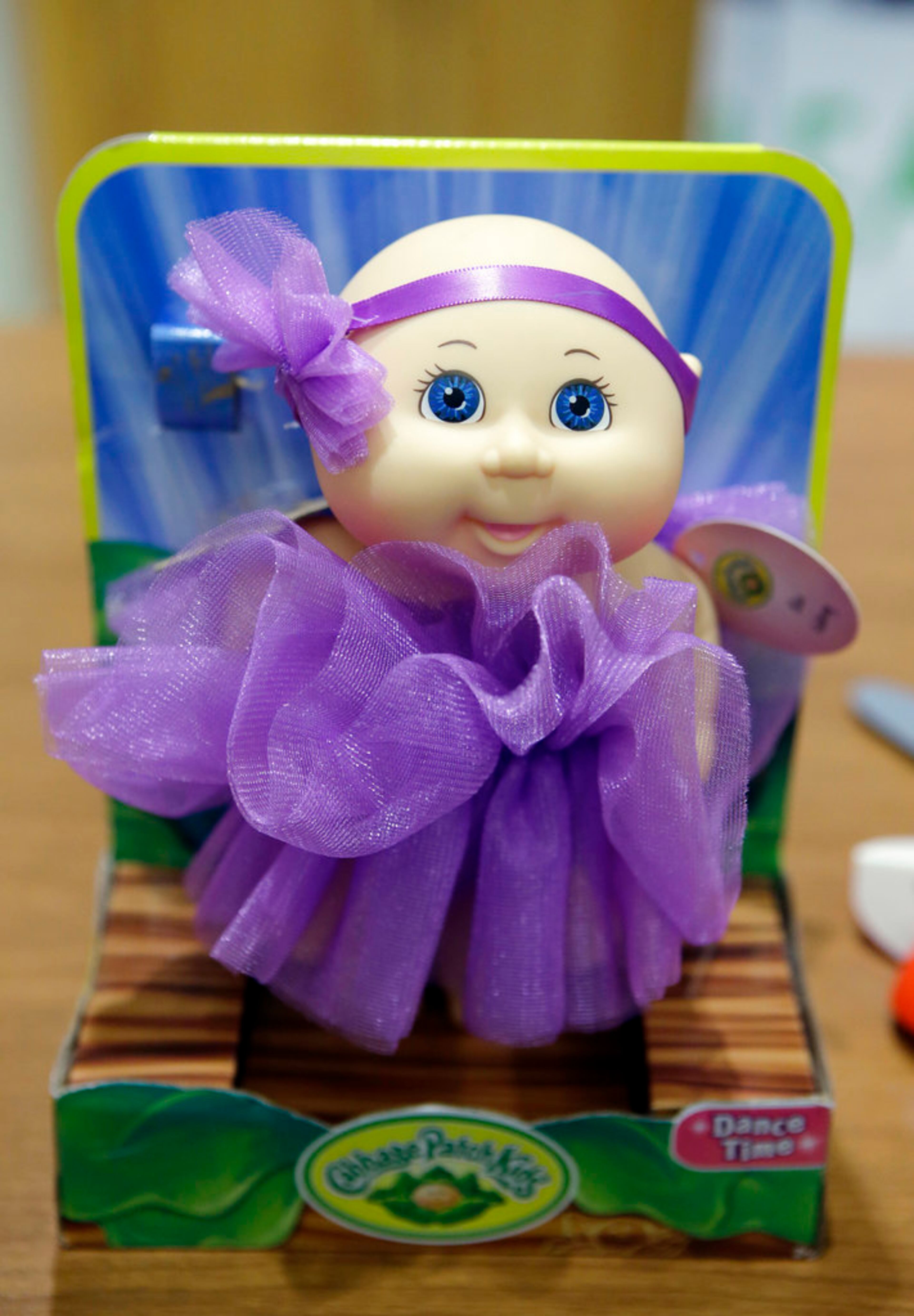 A Cabbage Patch Kids Dance Time Doll, which is on the World Against Toys Causing Harm, or W.A.T.C.H., list of worst toys for the holiday season, rests on a table before a news conference, Tuesday, Nov. 13, 2018, at a hospital, in Boston. The Massachusetts-based consumer safety group says the doll is sold with a removable headband which could be ingested. (AP Photo/Steven Senne)
