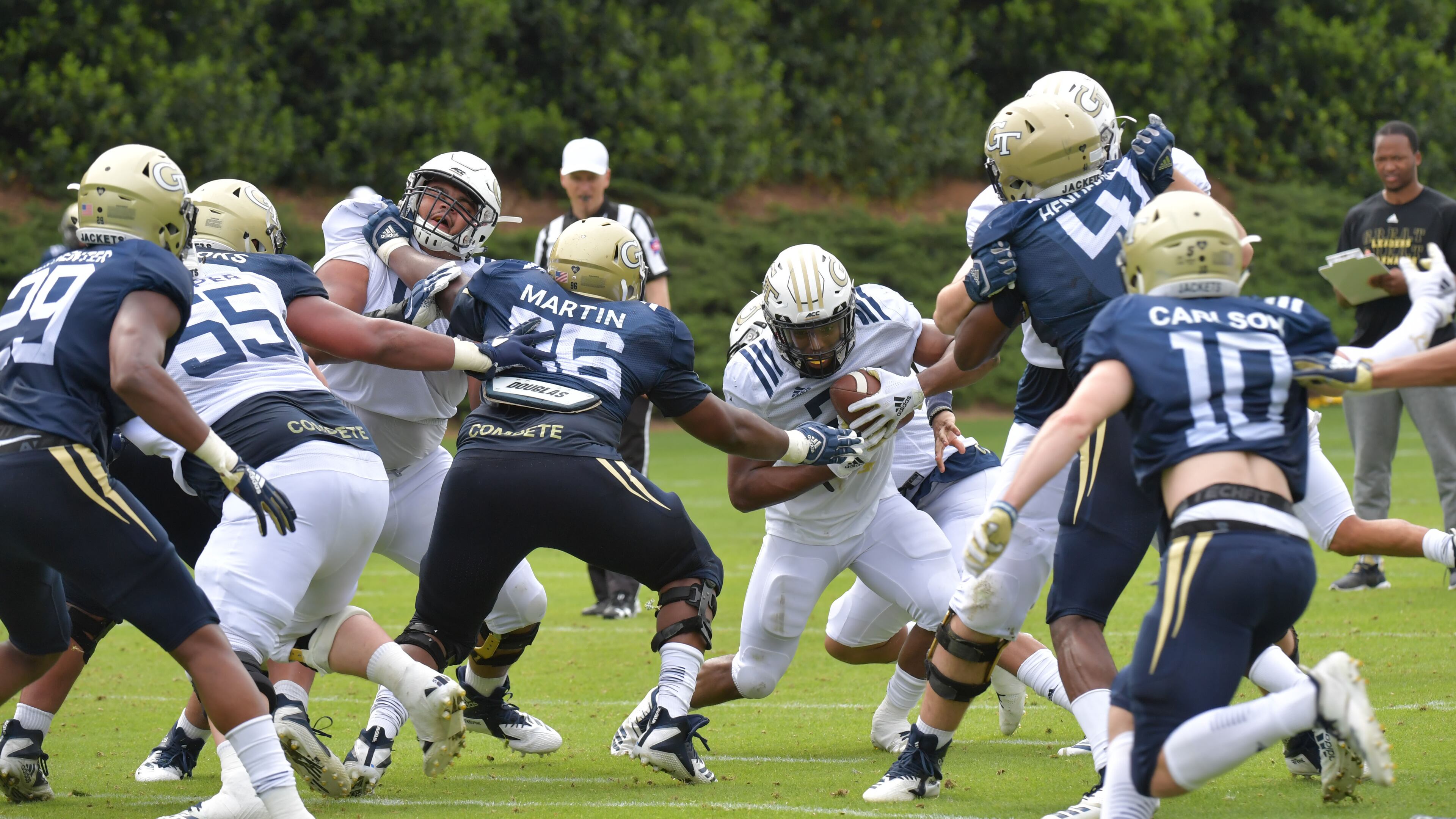 Georgia Tech Jordan Mason (center) carries the ball during a practice session Thursday, April 18, 2019, at Georgia Tech's football outdoor practice field in Atlanta.