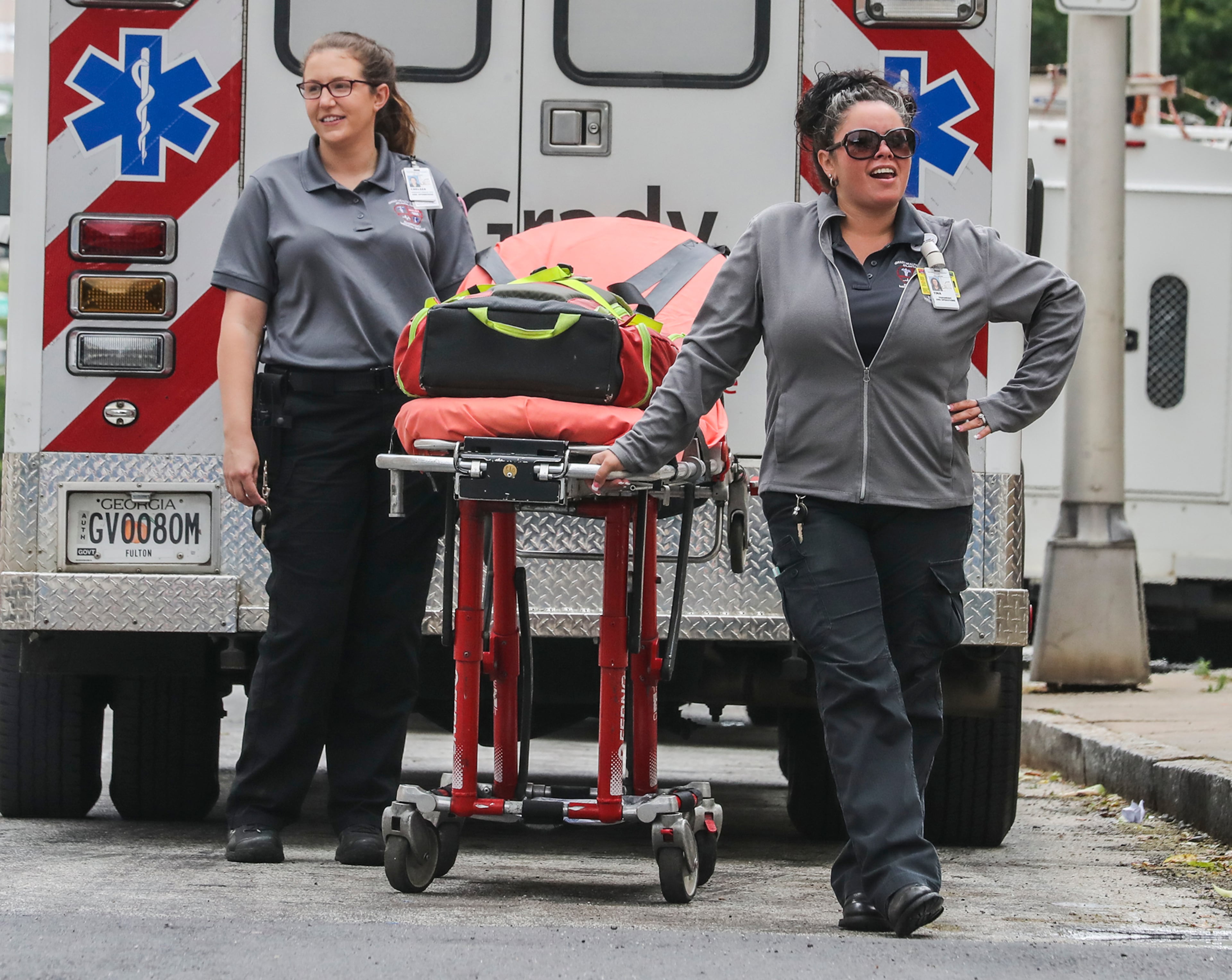 May 19, 2020 Atlanta: Grady EMS EMT, Chelsea Farmer (left) and paramedic, Tina Richardson (right). EMT Chelsea Farmer reflected on her service during the pandemic saying, "Service in my community has meant everything, they really come together. We've had lunches brought and snacks almost every single day, support signs throughout the city, it's been great." Paramedic Tina Richardson concurred,"All the hospitals and our co-workers and everyone get together, they're made sure we have lunch everyday, make sure we're taken care of."
JOHN SPINK/JSPINK@AJC.COM