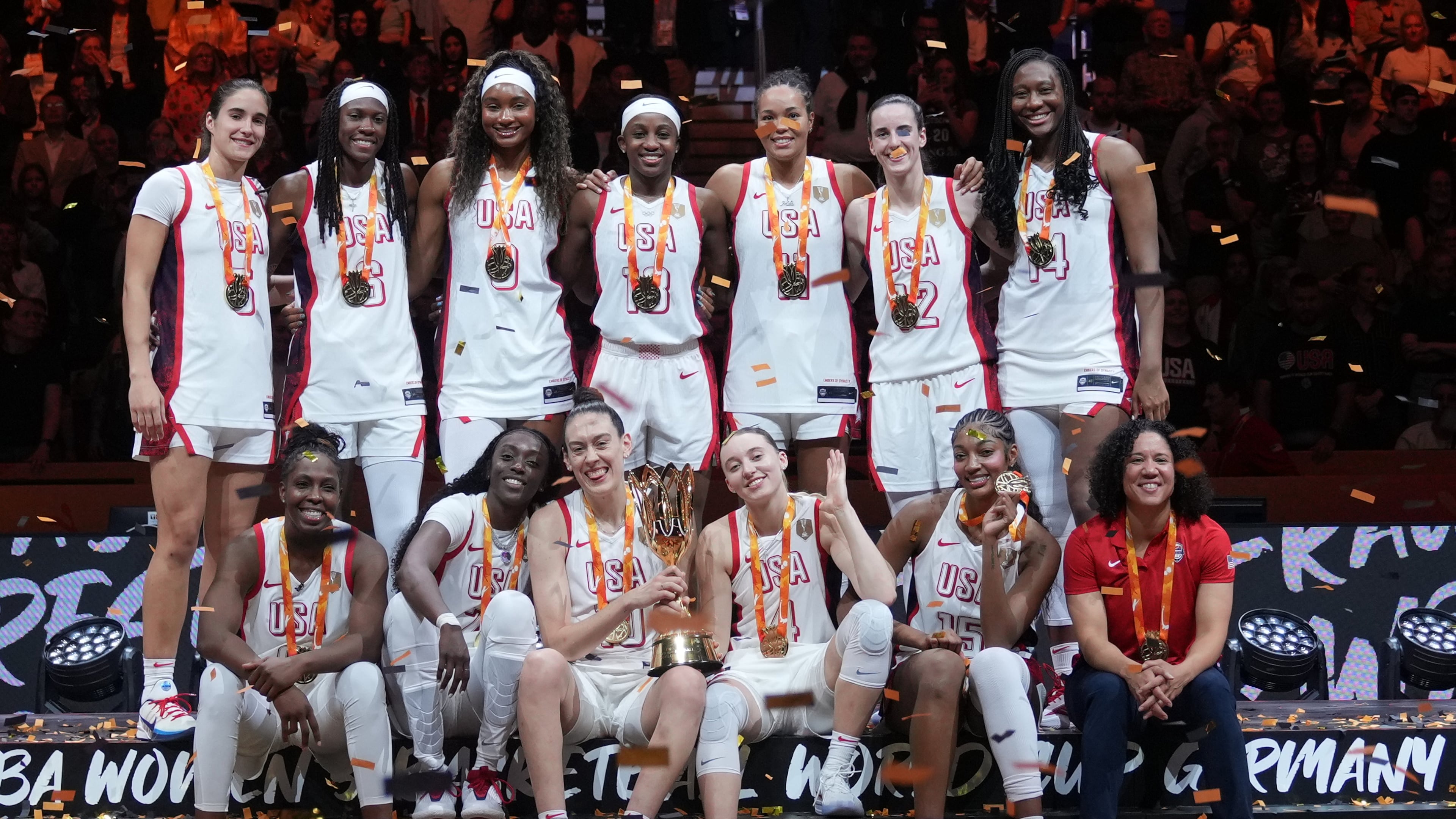 United States plyers pose on the podium after winning the Women's Basketball World Cup final match between the United States and France in Berlin, Sunday, Sept. 13, 2026. (AP Photo/Ebrahim Noroozi)