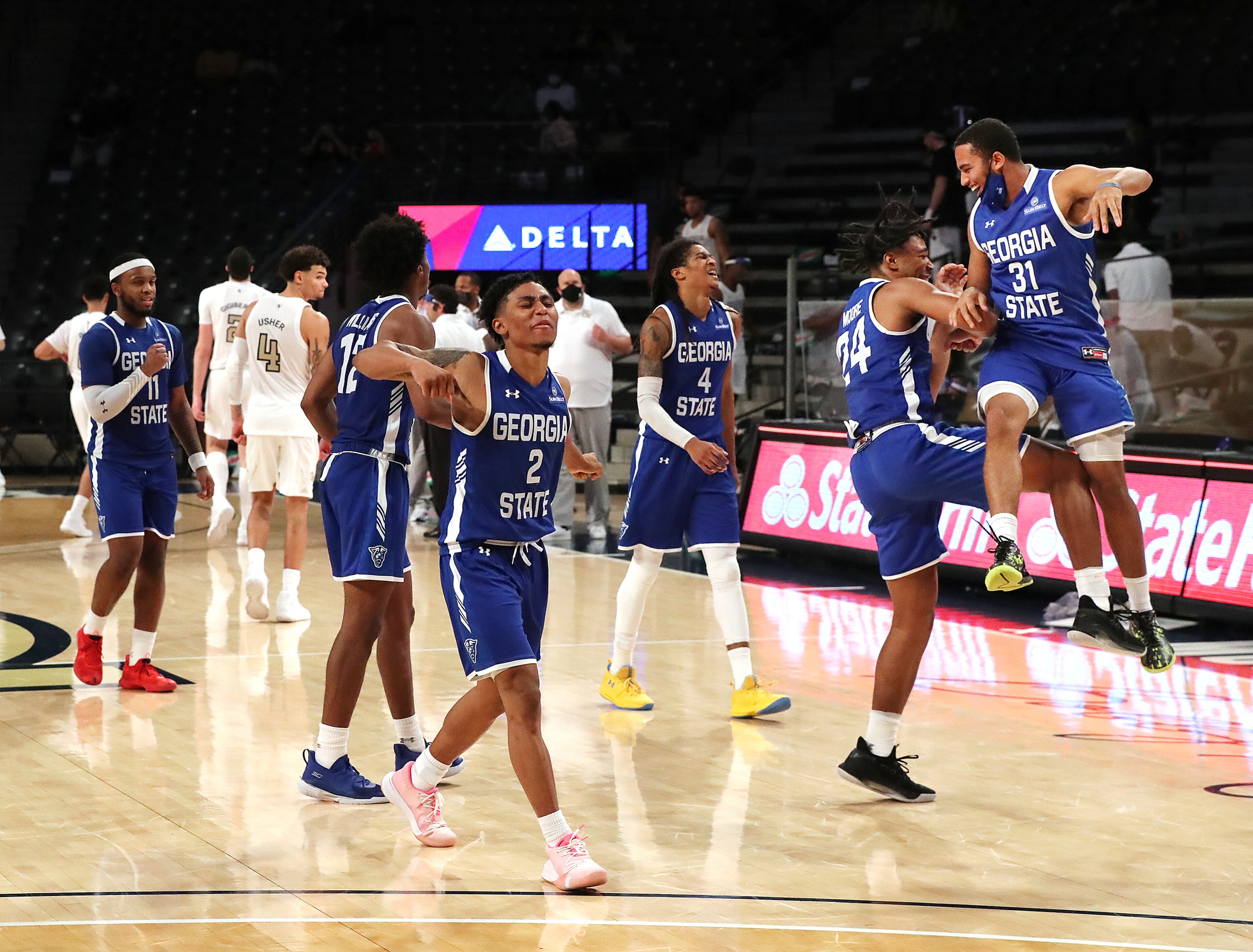 Georgia State players celebrate as time expires. “Curtis Compton / Curtis.Compton@ajc.com”