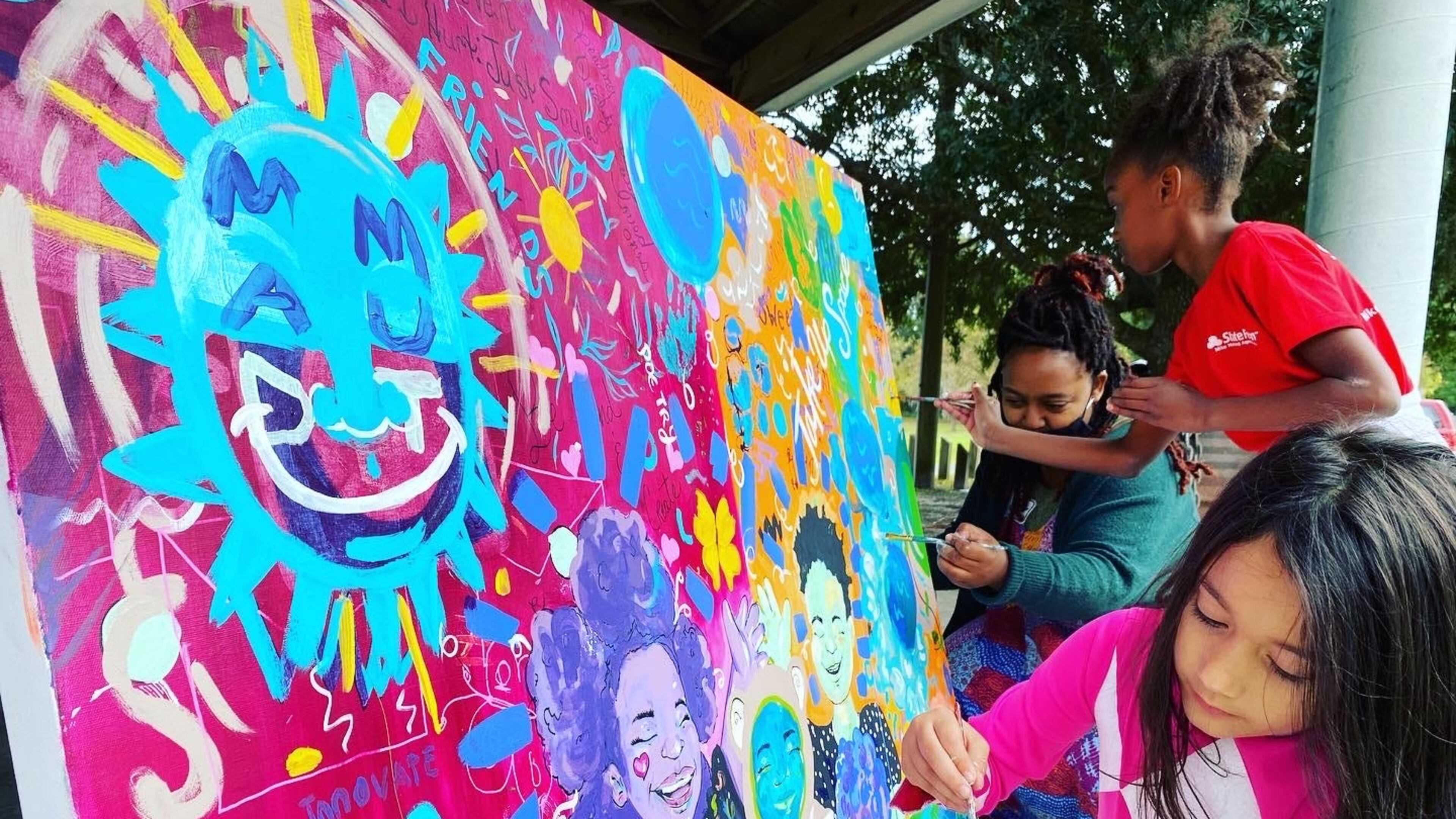 Kids work with local artist Ne'Keisha Jones on a piece at one of Hello Savannah's past events.