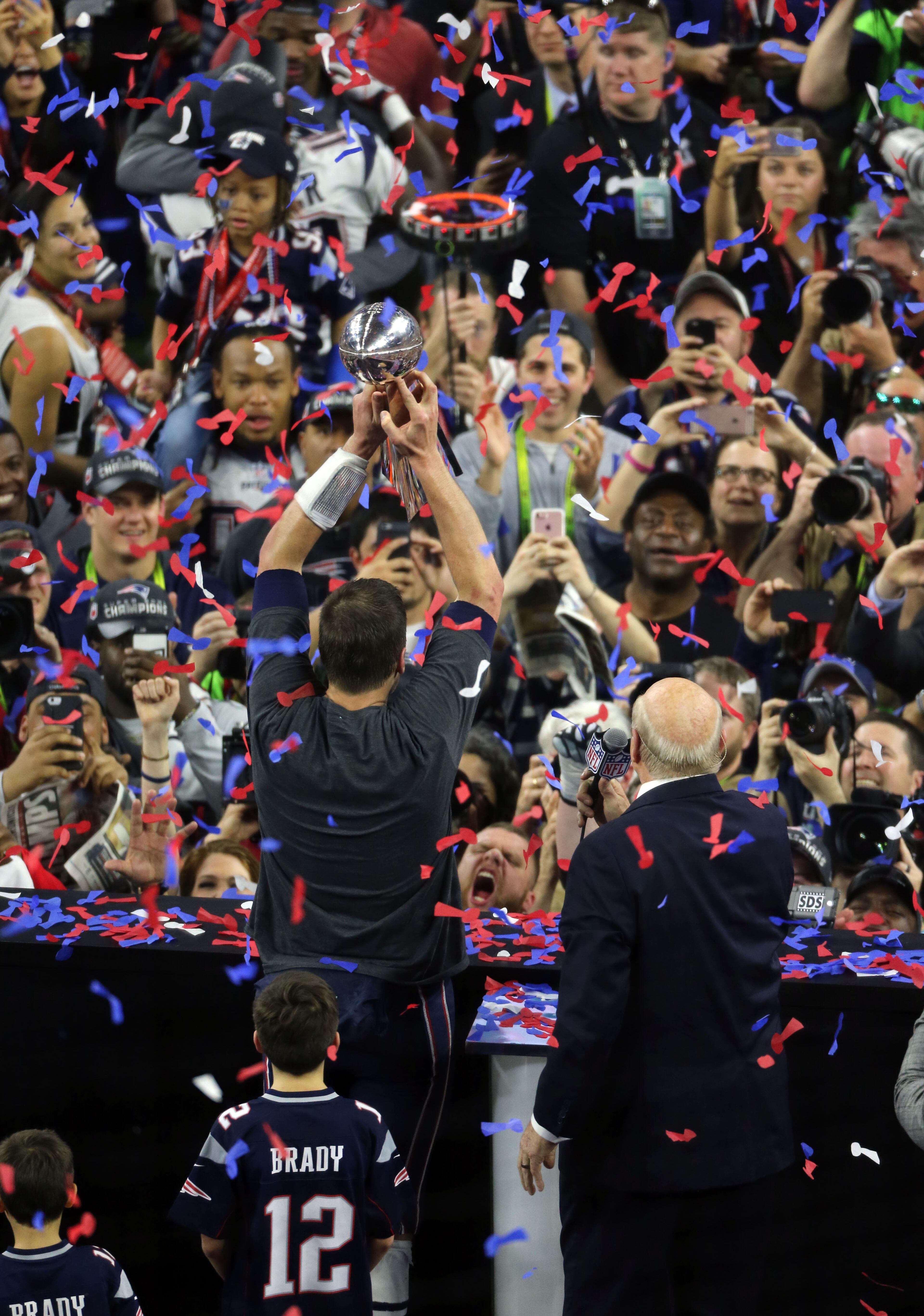 FEBRUARY 5, 2017 HOUSTON TX New England Patriots quarterback Tom Brady (12) holds up the Vince Lombardi championship trophy on the field at the end of the game as the Atlanta Falcons meet the New England Patriots in Super Bowl LI at NRG Stadium in Houston, TX, Sunday, February 5, 2017. The Patriots beat the Falcons in OT 34-28. John Spink/AJC