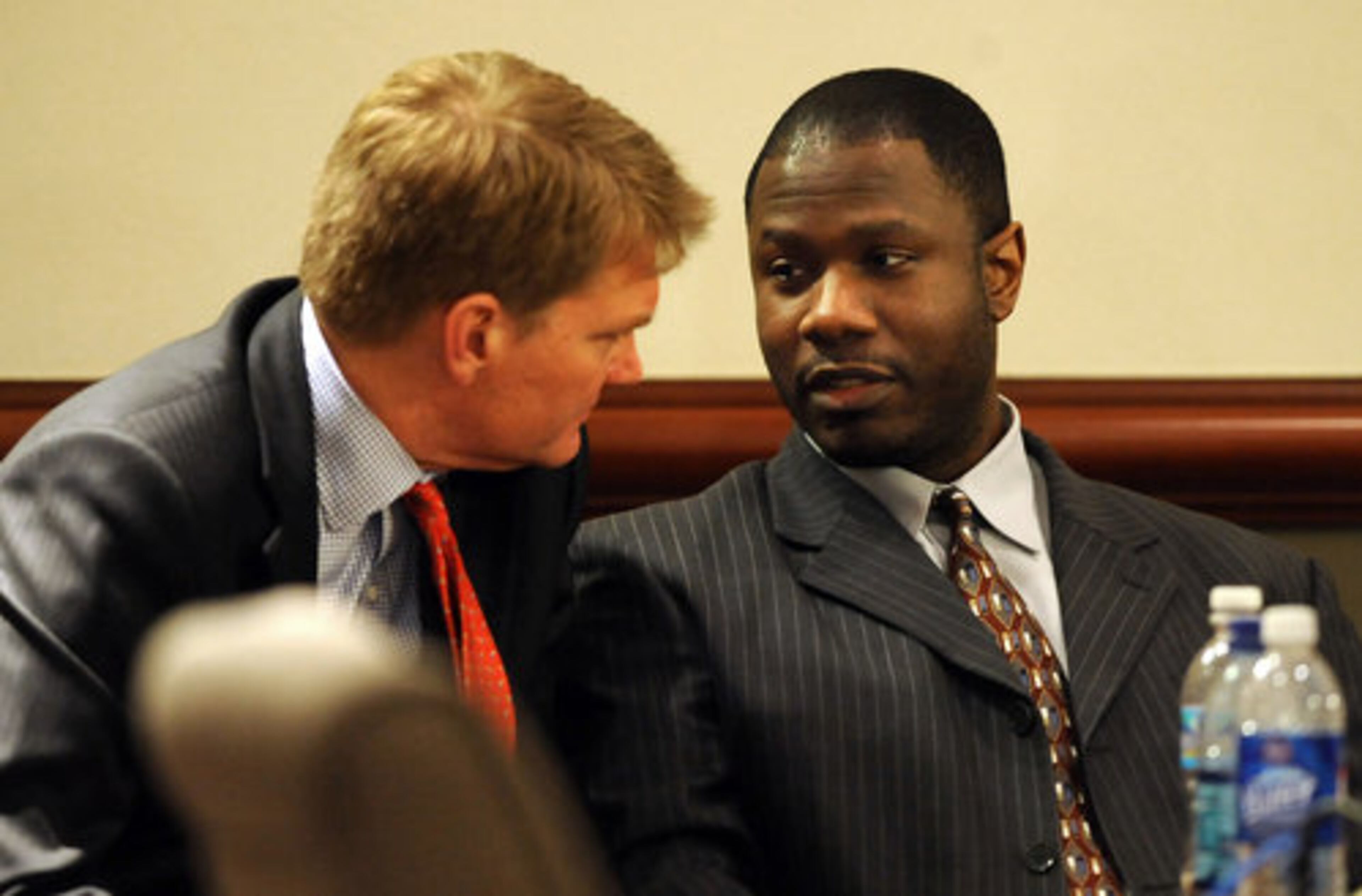 Brian Nichols talks to defense attorney Robert McGlasson (left) after the verdict was read.