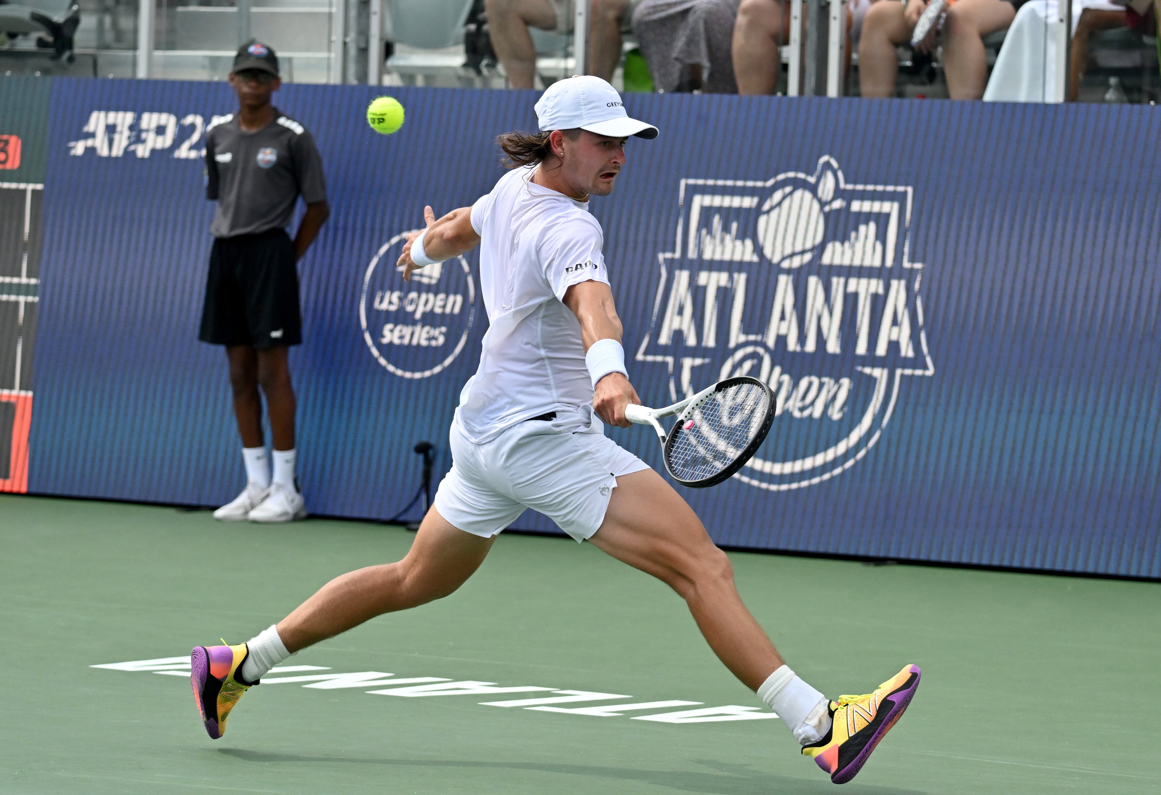 J.J. Wolf returns the ball to Taylor Fritz during a semifinal match at the 2023 Atlanta Tennis Open at Atlantic Station, Saturday, July 29, 2023, in Atlanta. (Hyosub Shin / Hyosub.Shin@ajc.com)