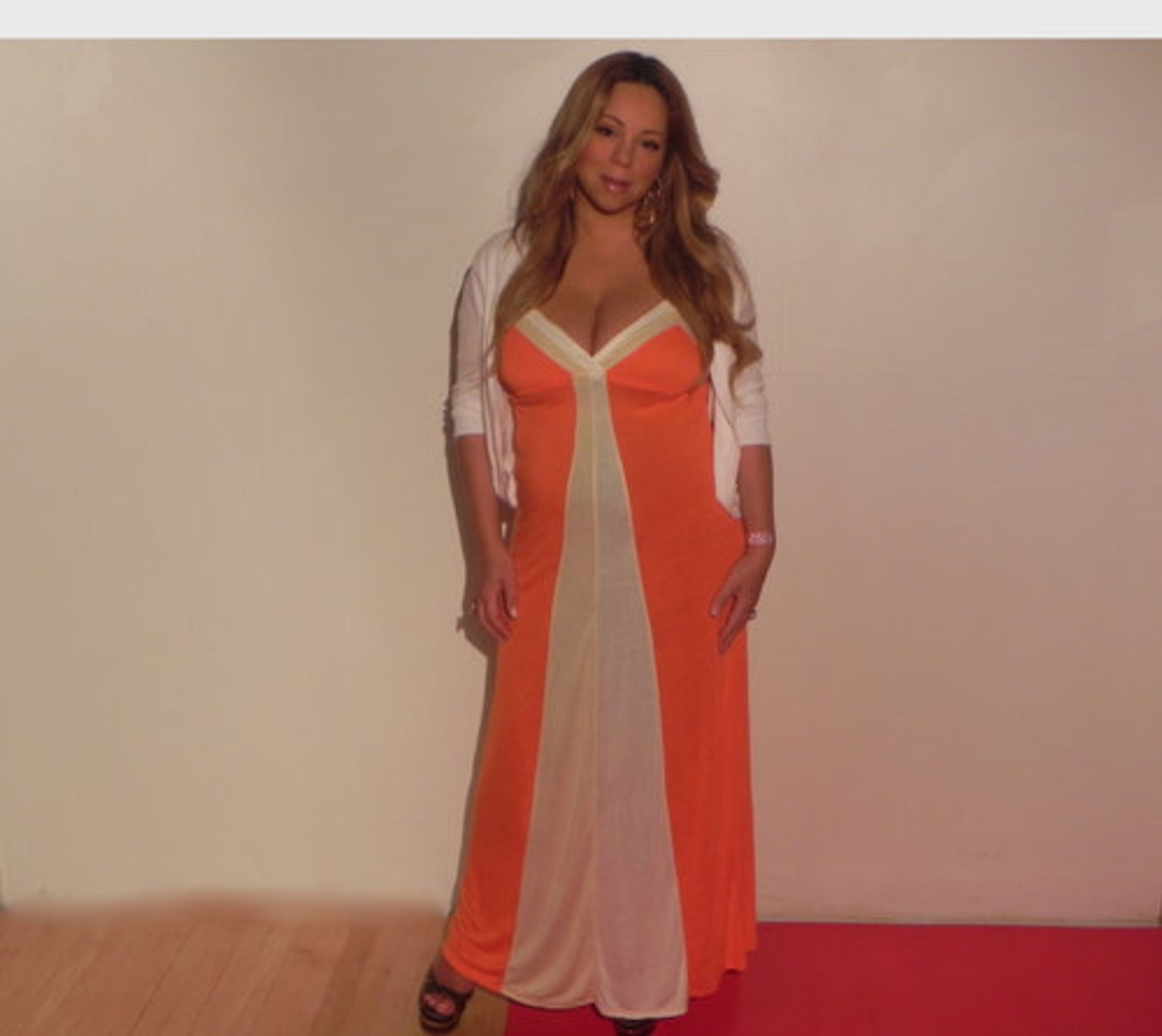 Carey posed in July 2011, three months after giving birth to twins and before her 30 lb. weight loss.