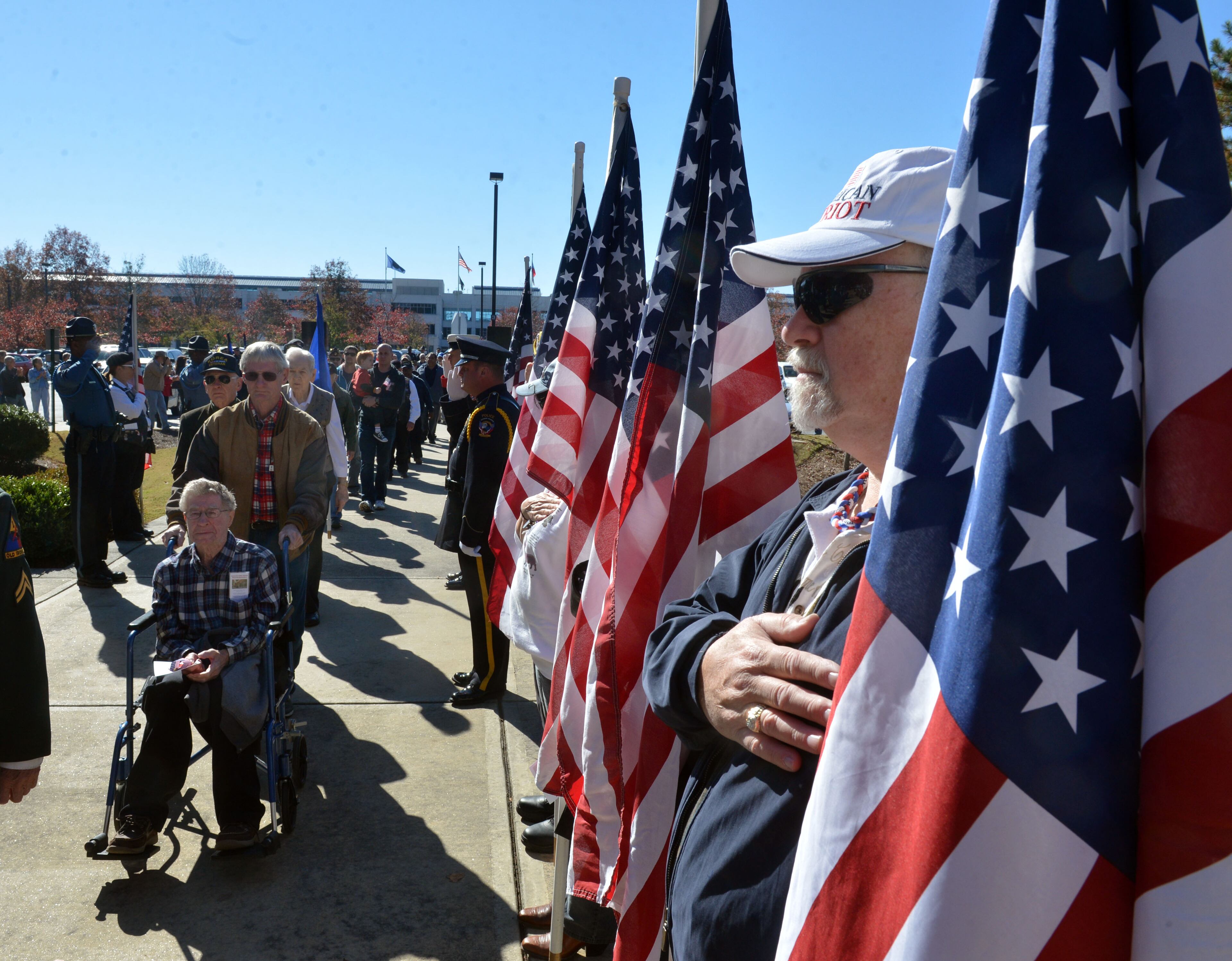 Harry Leach with the Patriot Guard Riders salutes as veterans enter Nov. 11, 2013 at the Fallen Heroes Memorial in Lawrenceville during Gwinnett County's Veterans Day Ceremony.