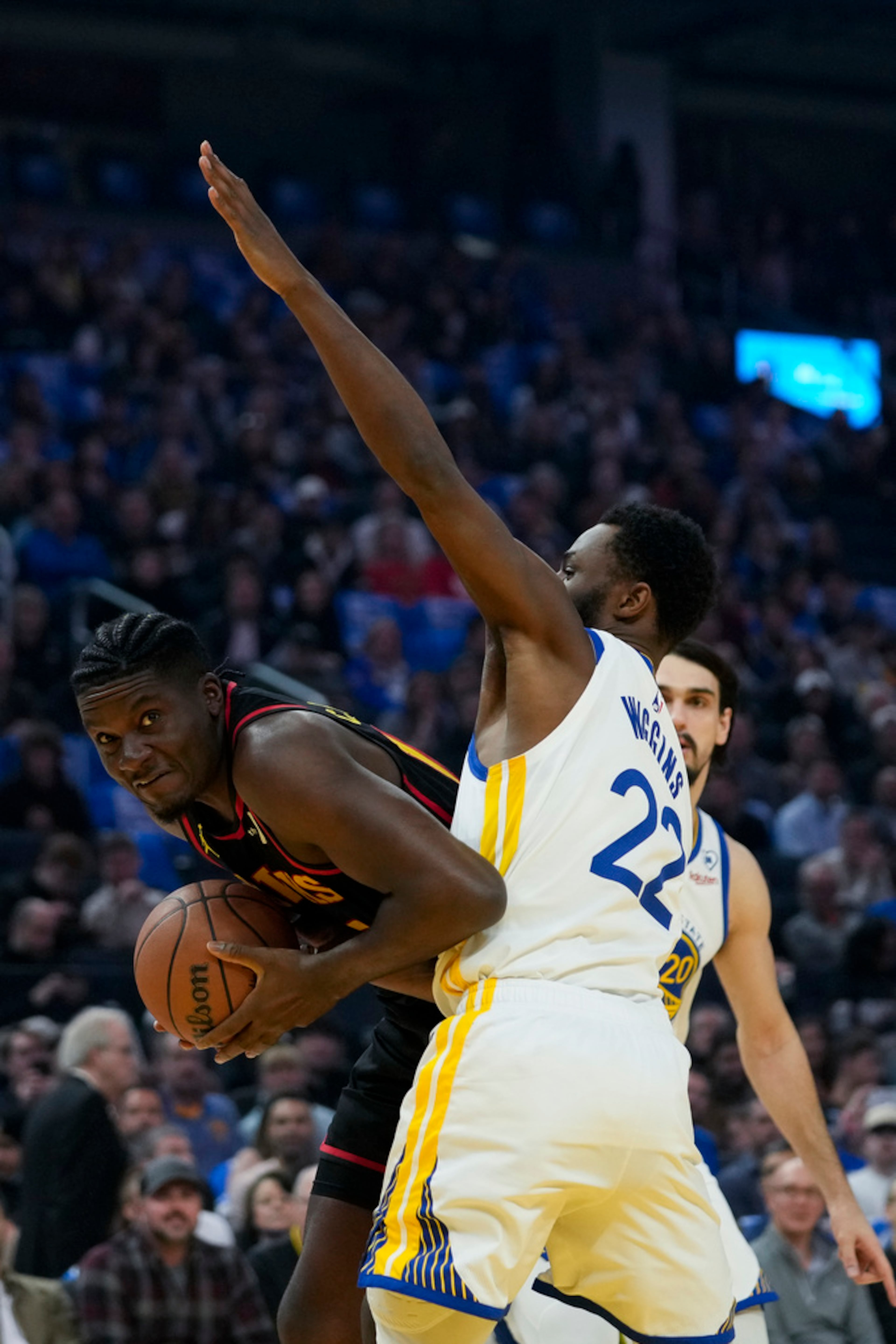 Atlanta Hawks center Clint Capela, left, tries to get around Golden State Warriors forward Andrew Wiggins during the first half of an NBA basketball game, Wednesday, Jan. 24, 2024, in San Francisco. (AP Photo/Godofredo A. Vásquez)