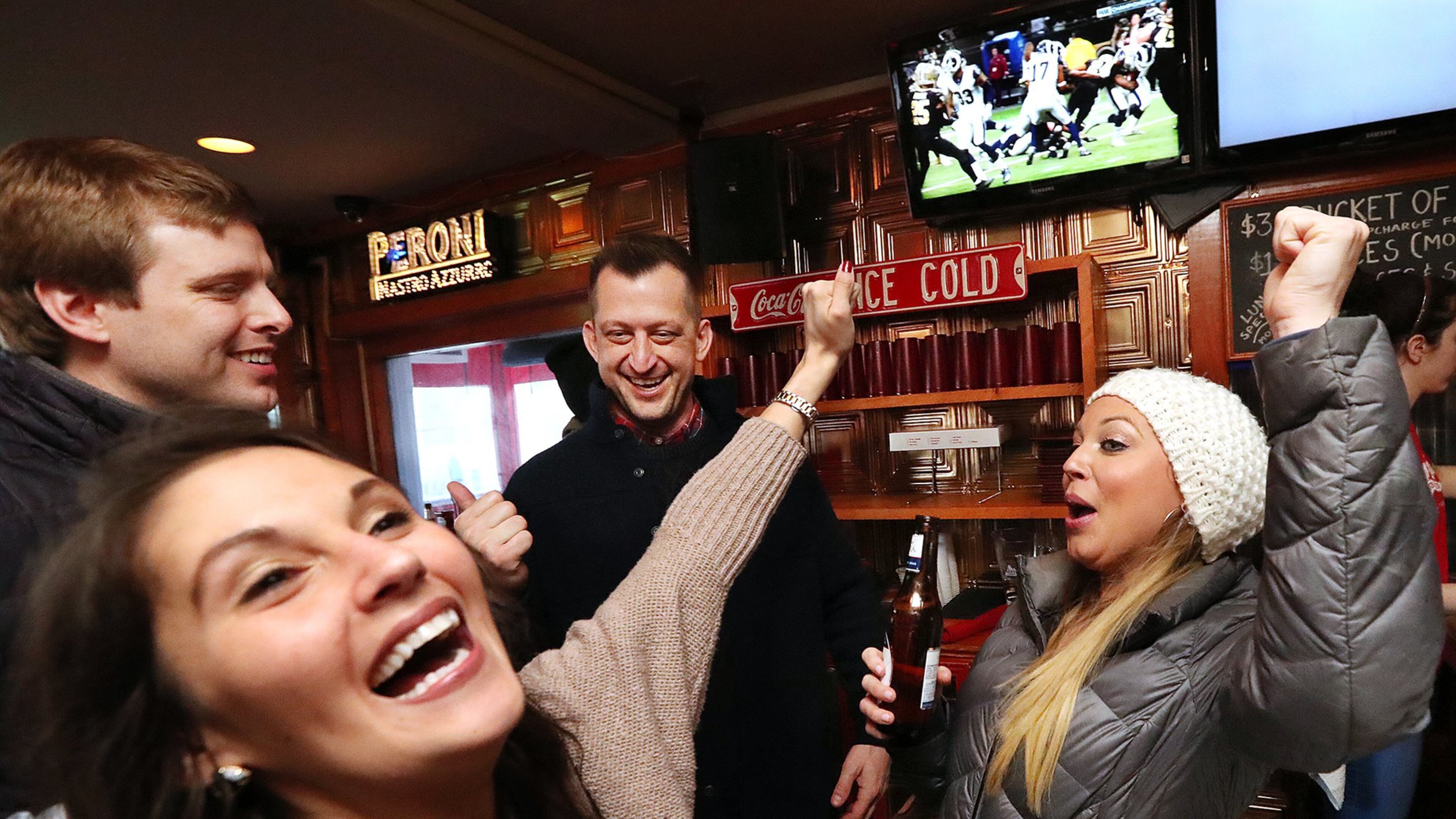 Falcons fans Ryan Montgomery (from left), Tiffany McCoy, Timothy Kotoski and Raegan McCoy cheer as the Rams score against the Saints while watching the NFC Championship game at Elbow Room Sports Pub & Pizzeria on Sunday, Jan. 20, 2019, in Atlanta. The Rams went on to defeat the Falcons’ dreaded rivals from New Orleans. (Photo: Curtis Compton/ccompton@ajc.com)