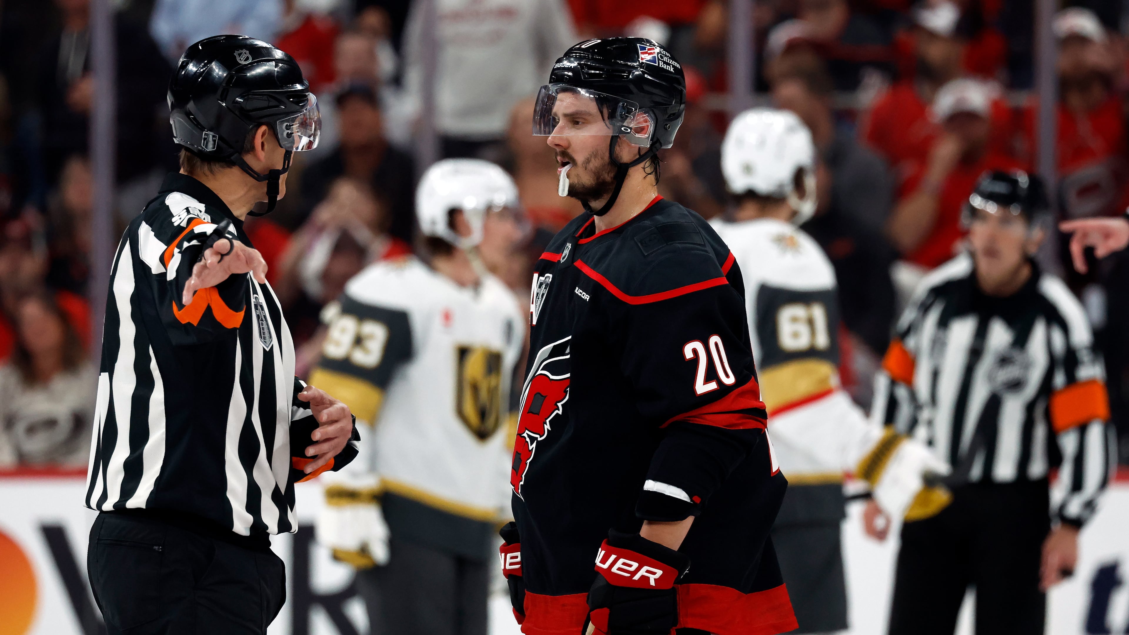 Carolina Hurricanes' Sebastian Aho (20) gets an explanation from an official during the second period in Game 1 of the NHL hockey Stanley Cup Final series against the Vegas Golden Knights in Raleigh, N.C., Tuesday, June 2, 2026. (AP Photo/Karl DeBlaker)