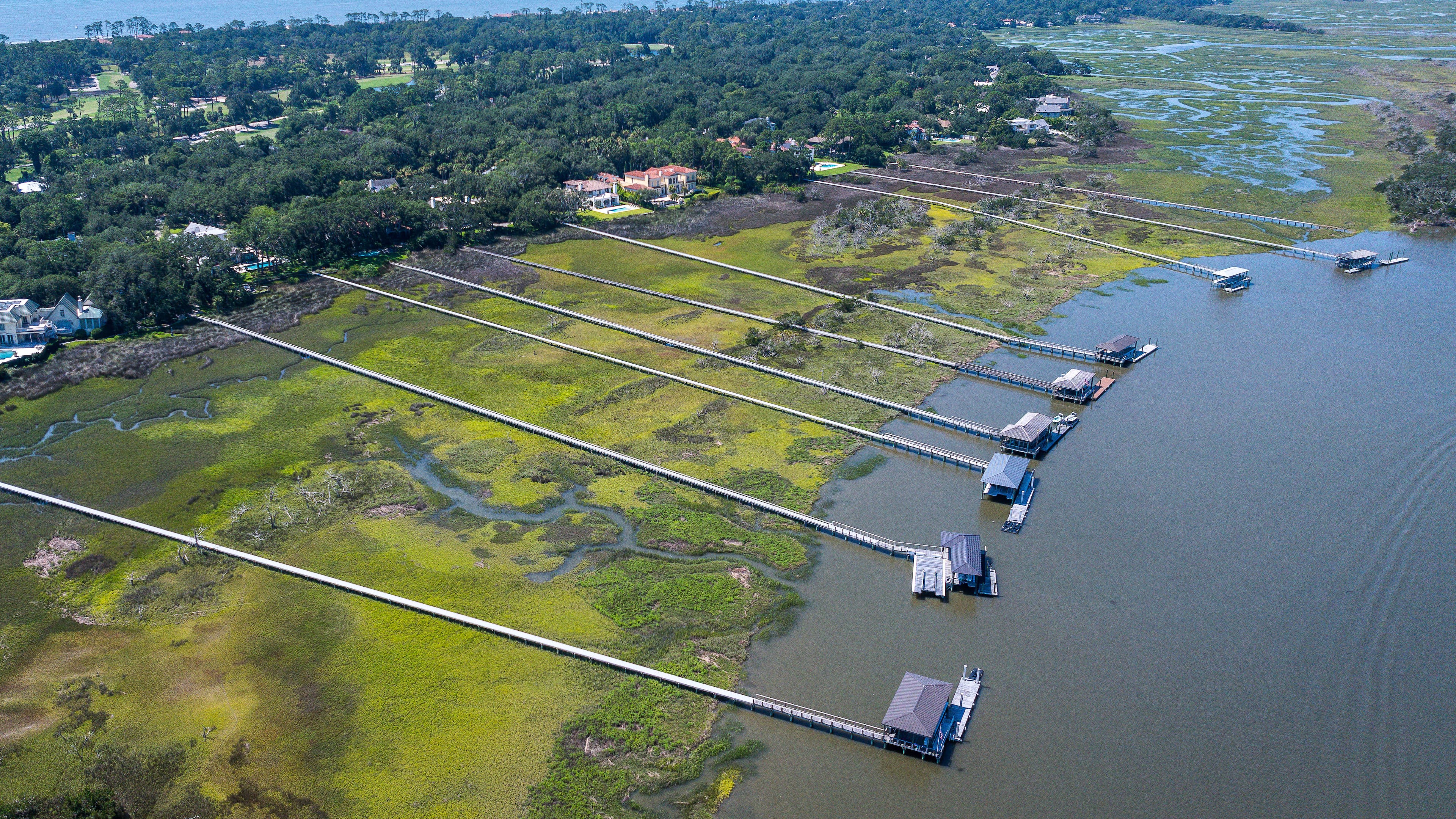 Docks extend across the marsh on Sea Island, Ga., Friday, June 17, 2026. (Justin Taylor/The Current/CatchLight/Report for America via AP)