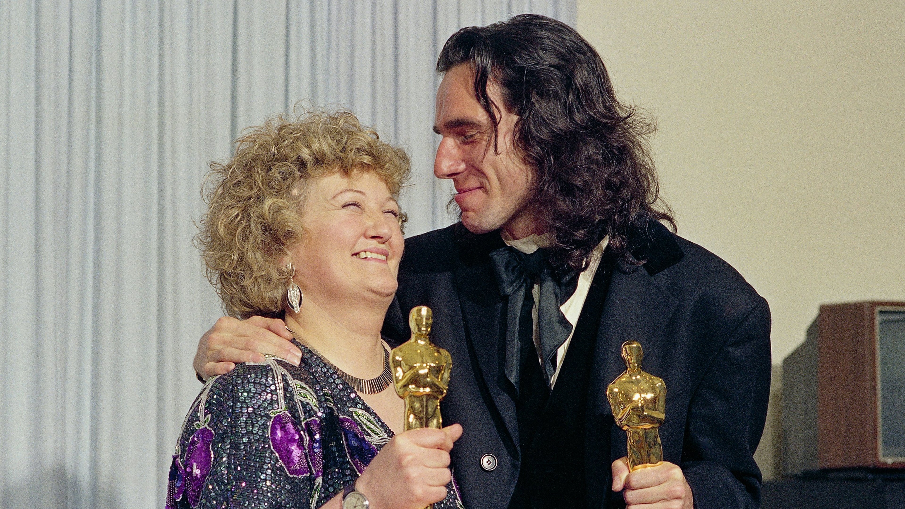 FILE - "My Left Foot" stars Brenda Fricker, winner of Oscar for best supporting actress, and Daniel Day Lewis, winner of Oscar for best actor, at the 62nd Annual Academy Awards in Los Angeles, March 26, 1990. (AP Photo/Bob Galbraith, File)