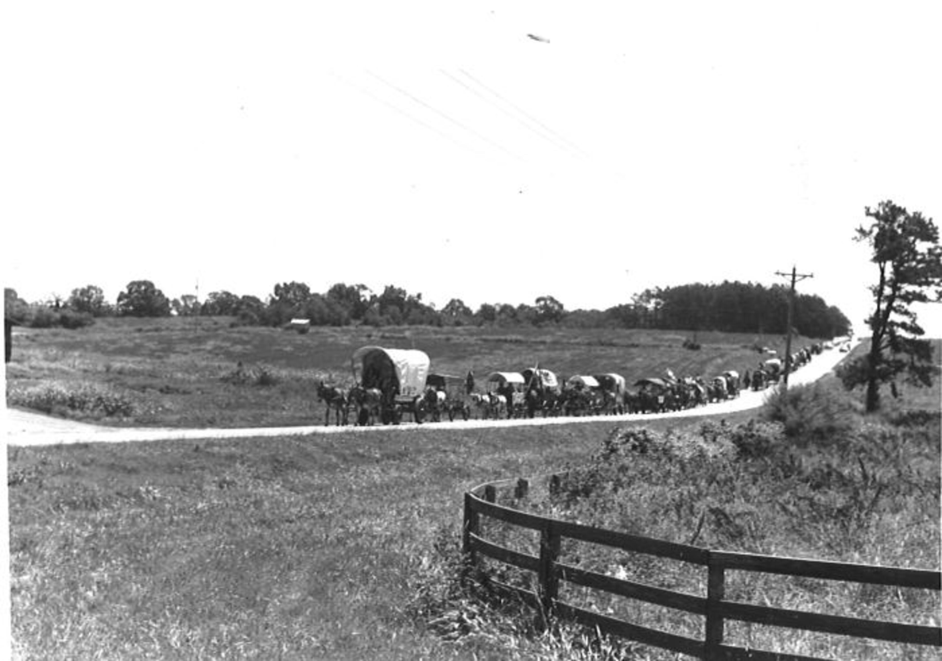 Farmers in a wagon train are seen in this undated photo.