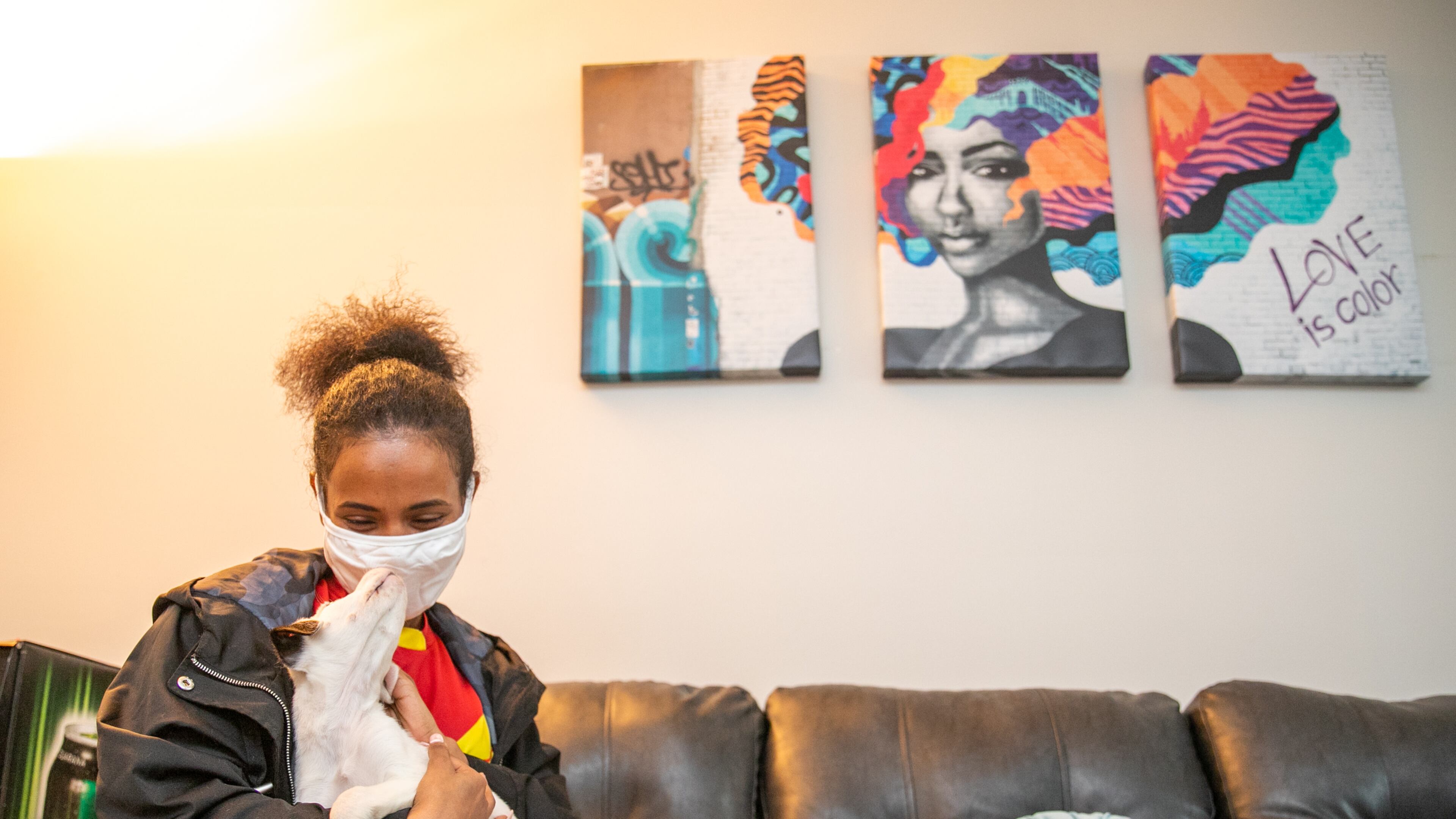 Rahel Tsada is a mother of three and an Ethiopian refugee who lived at the the Women’s Resource Center safe house in DeKalb County when the coronavirus lockdown happened. She has since moved to her own home and recently adopted a puppy. On Thursday, Tsada visited the center where she once lived and talked about her journey. "There’s a lot of love here,” she said. (Jenni Girtman for The Atlanta Journal-Constitution)