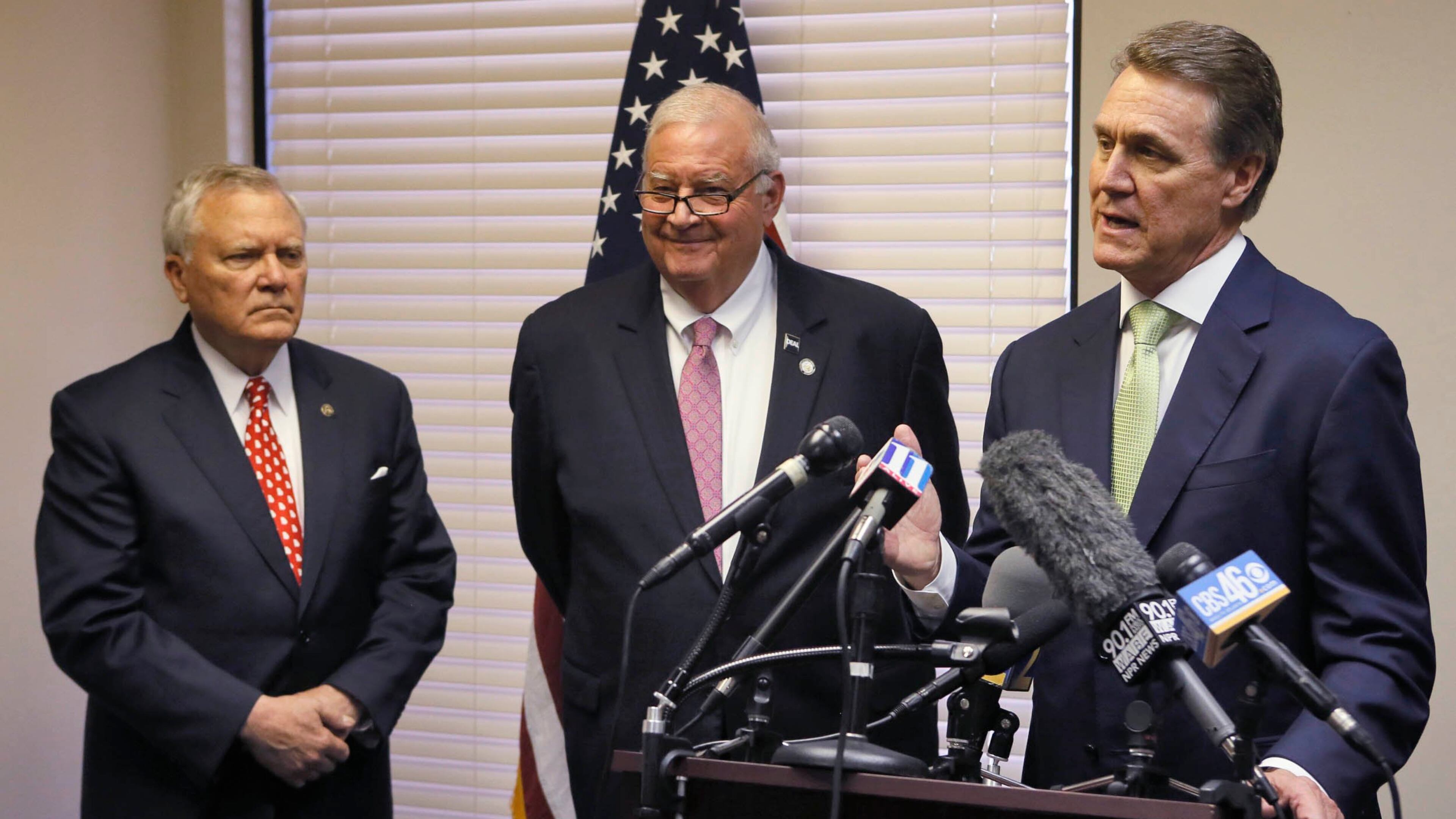 John Padgett stands between Gov. Nathan Deal and Sen. David Perdue. BOB ANDRES / BANDRES@AJC.COM