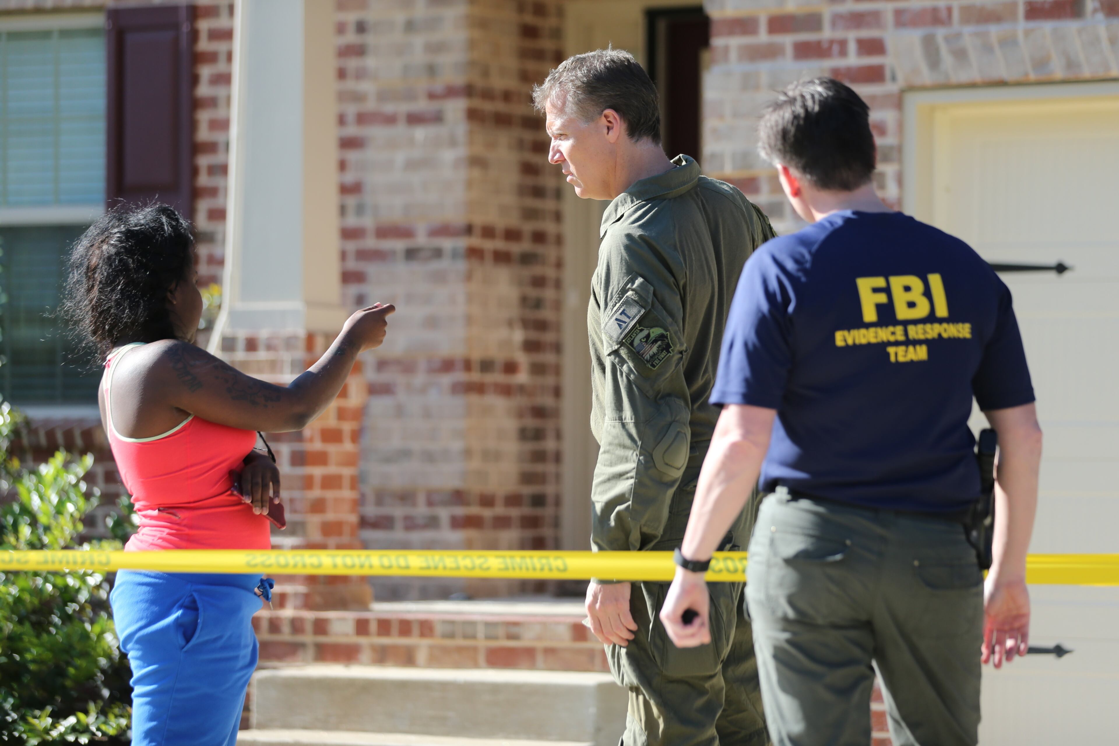 FBI agents, with guns drawn, smashed through the front door of a home in the 7700 block of Birdsview Drive in Fairburn shortly after 6 a.m., according to Channel 2 Action News. JOHN SPINK / JSPINK@AJC.COM
