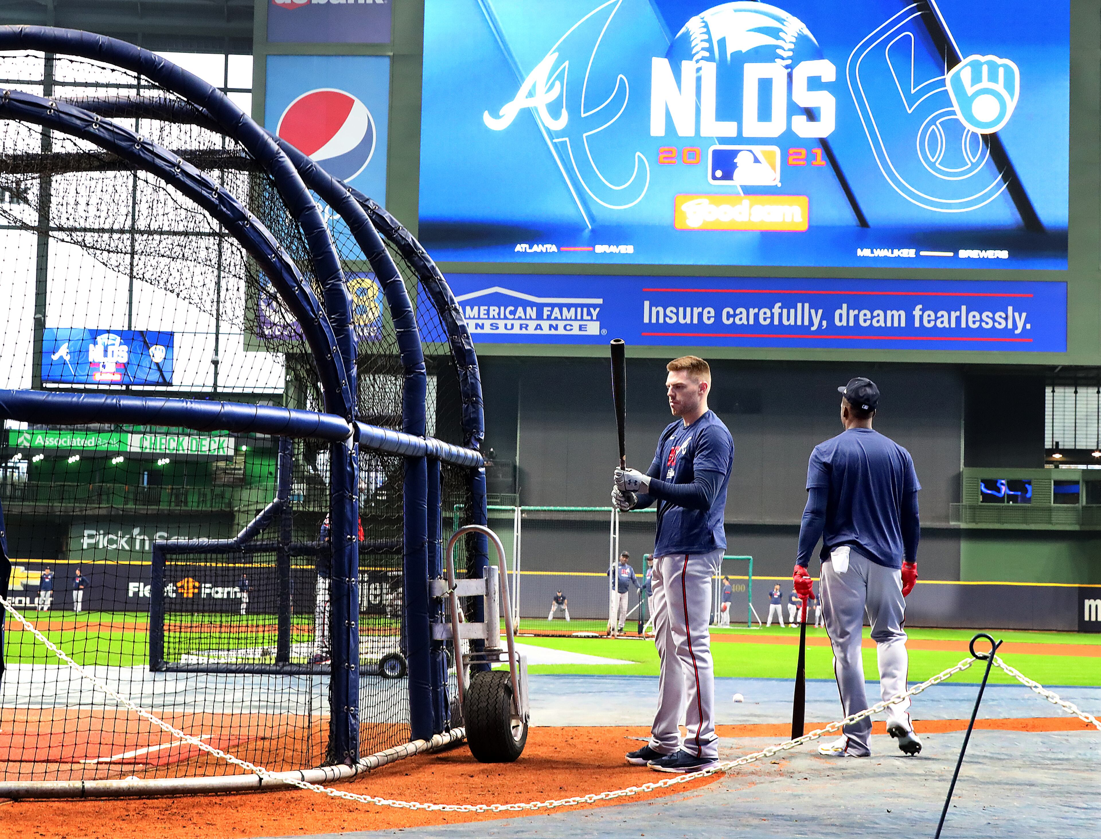 Braves first baseman Freddie Freeman (left0 and teammates take batting practice at American Family Field preparing for the opening game of the National League Division Series against the Milwaukee Brewers on Thursday, Oct. 7, 2021, in Milwaukee. “Curtis Compton / Curtis.Compton@ajc.com”