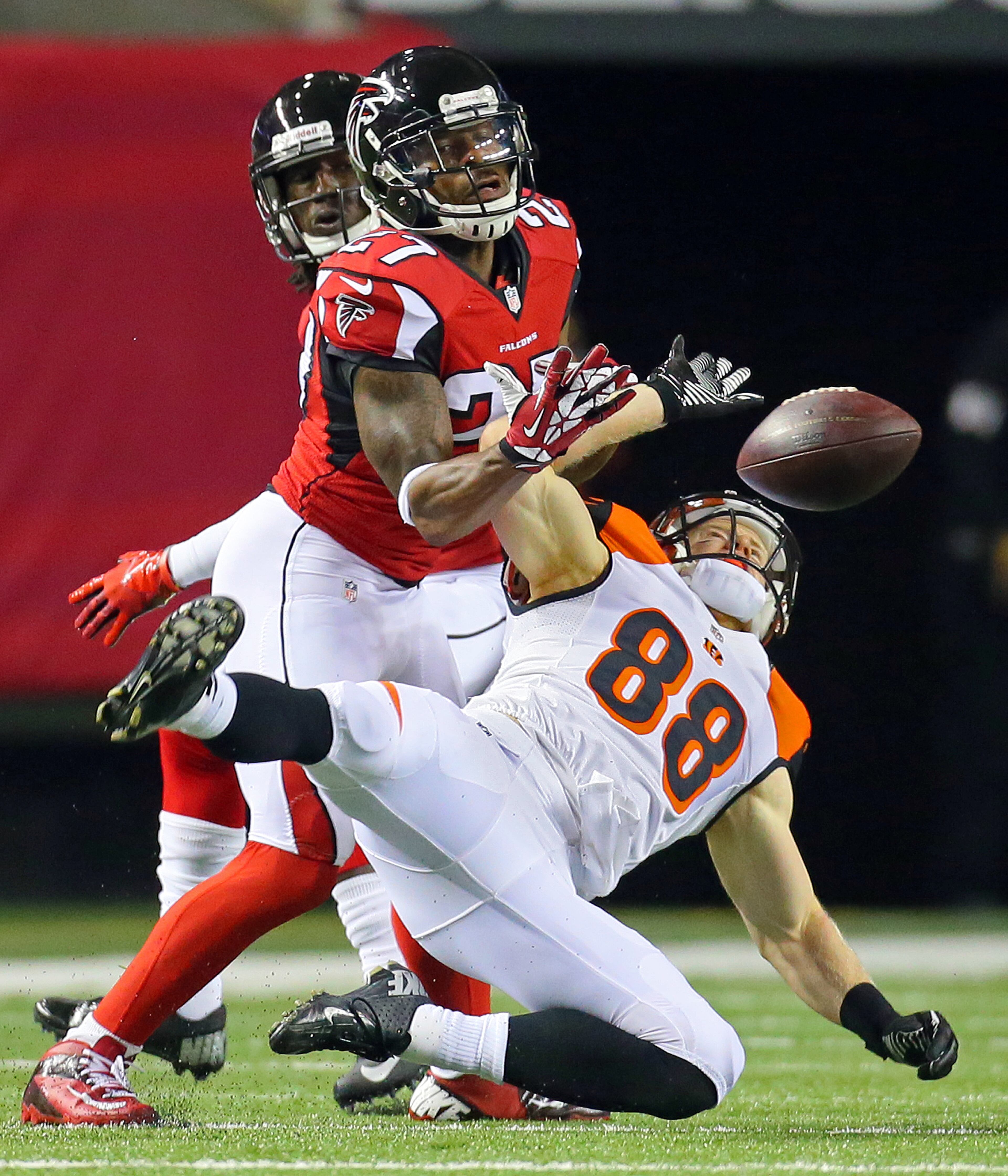 Falcons cornerback Robert McClain breaks up a pass to Bengals wide receiver Ryan Whalen during the first quarter of their NFL exhibition game on Thursday, August 8, 2013, in Atlanta.