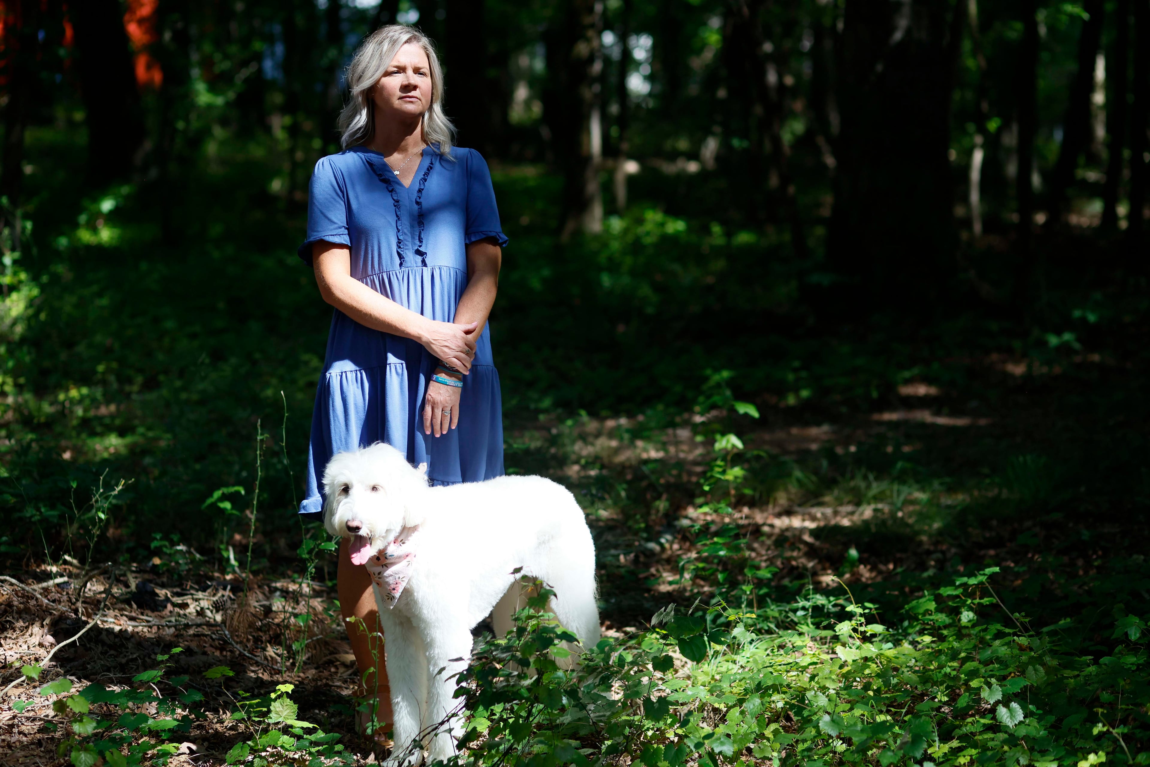 Ashley Worthey is shown outside her Good Hope, Ga., home with her 6-year-old dog, Evie Pearl, on Sunday, Aug. 9, 2026. (Miguel Martinez/AJC)