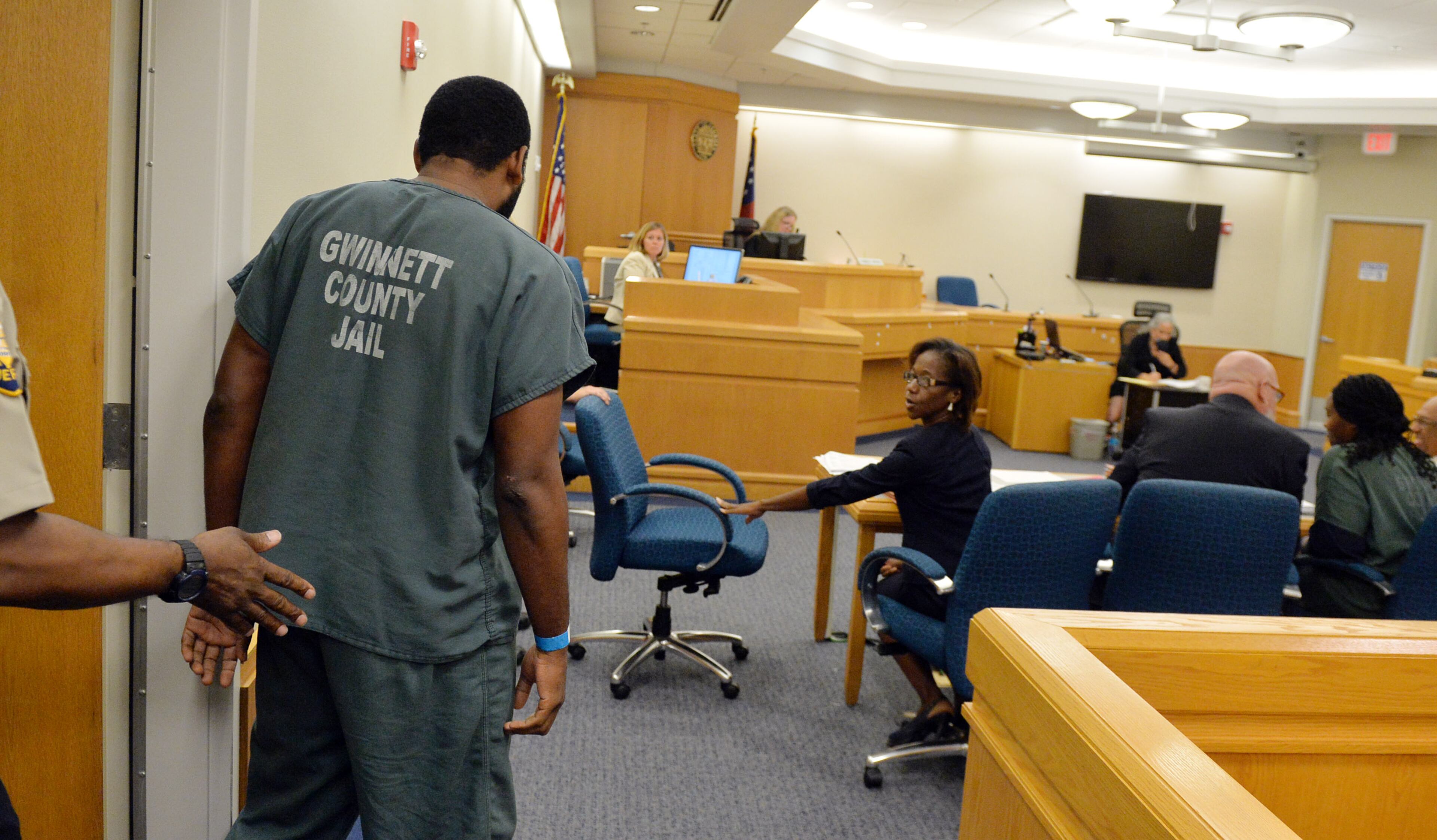 Recardo and Therian Wimbush appear before Gwinnett County Superior Court Judge Karen Beyers during a bond hearing Tuesday, August 5, 2014. The former Georgia Tech football star and his wife were denied bond. They are accused of locking their 13 year old son in the basement for months. KENT D. JOHNSON/KDJOHNSON@AJC.COM