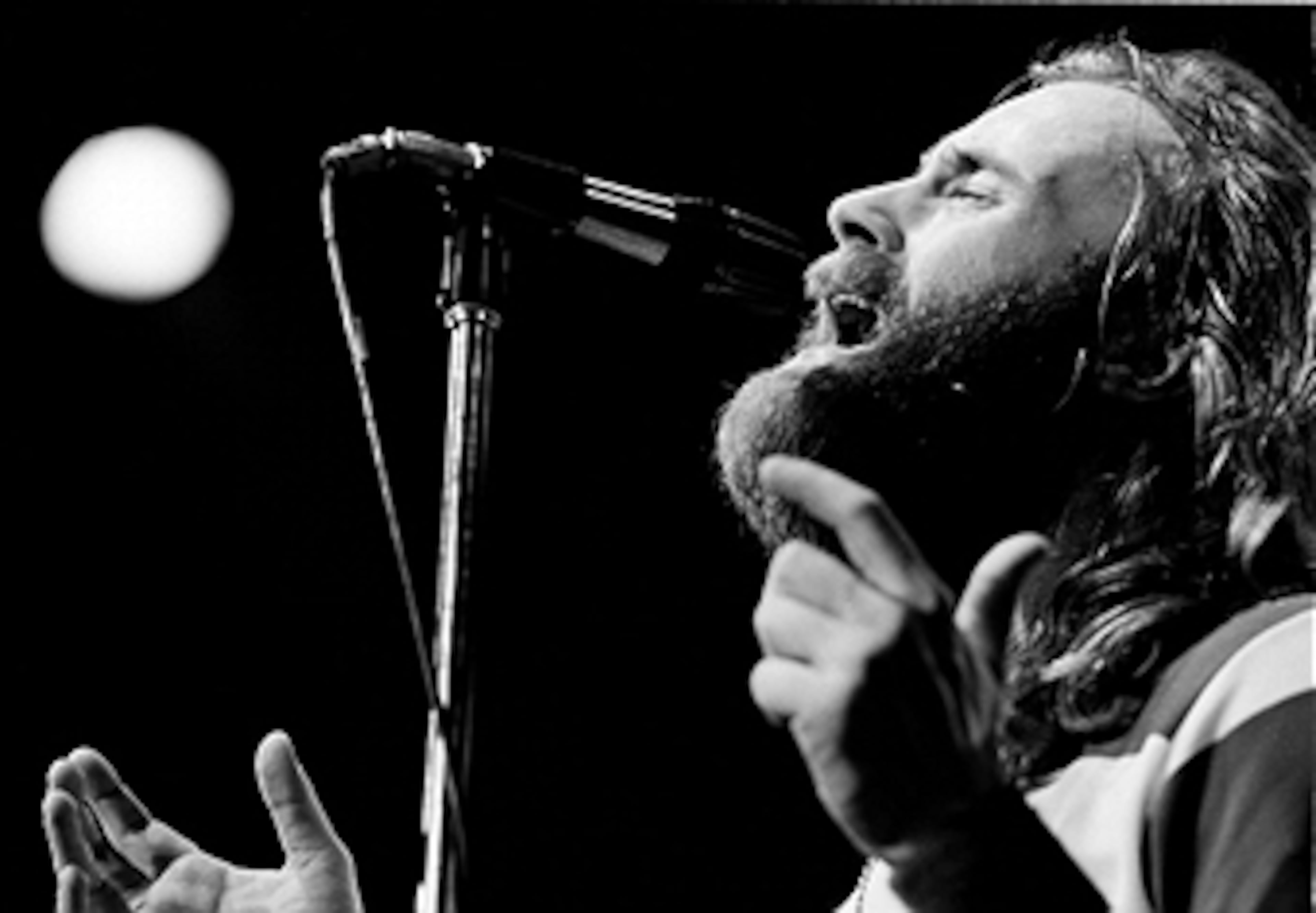 Singer Phil Collins of Genesis performing on stage in New York City in 1977. (Photo by Michael Putland/Getty Images)