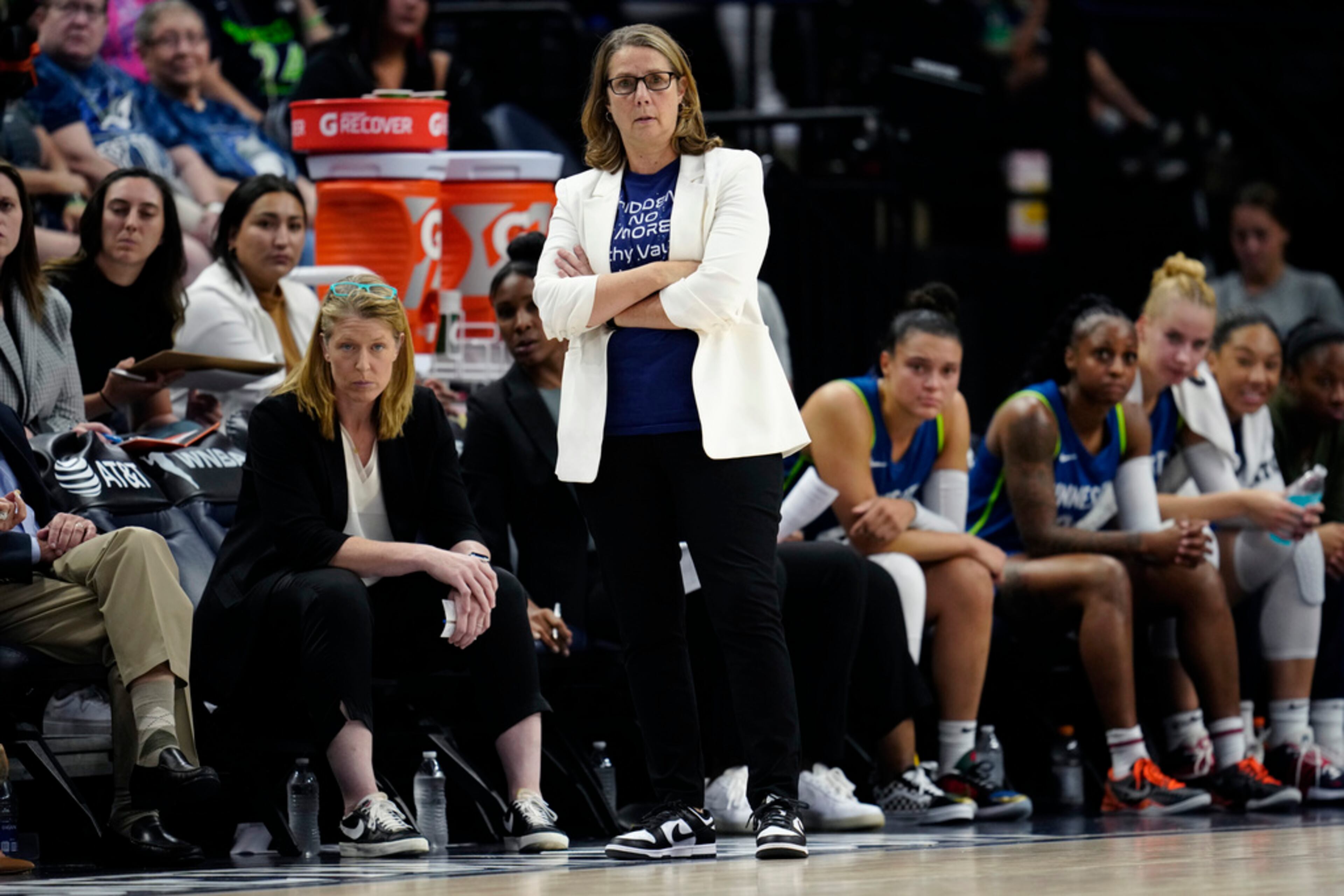 Minnesota Lynx head coach Cheryl Reeve, center, watches play during the first half of a WNBA basketball game against the Atlanta Dream, Friday, Sept. 1, 2023, in Minneapolis. (AP Photo/Abbie Parr)