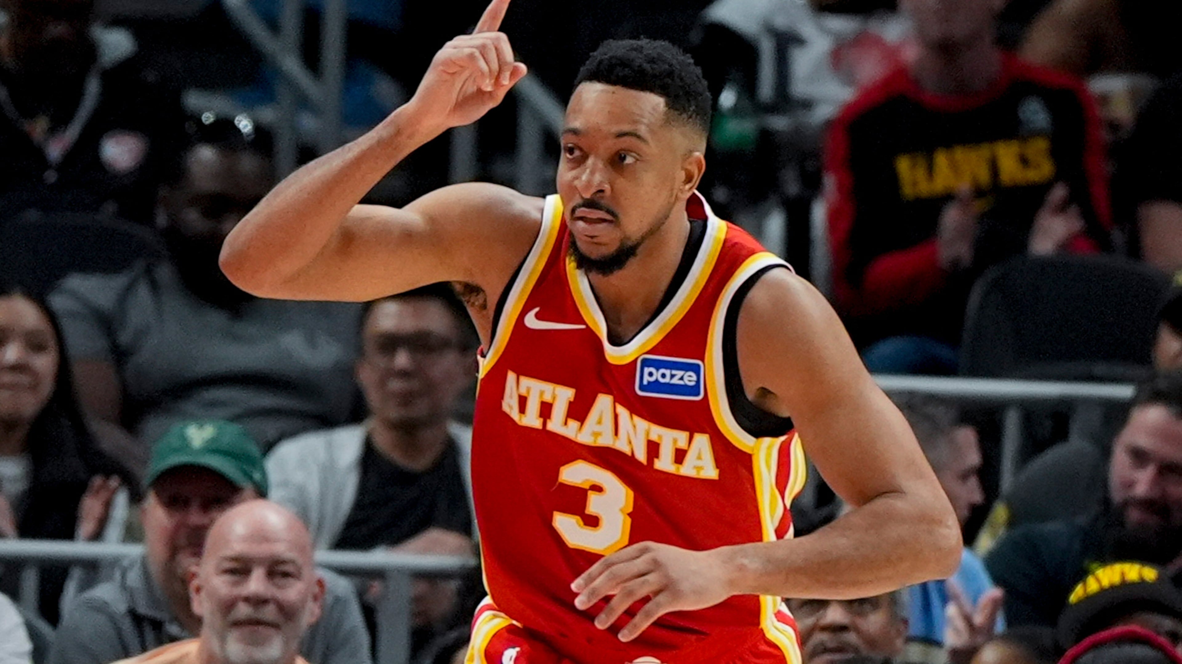 Atlanta Hawks guard CJ McCollum (3) celebrates a basket against the Milwaukee Bucks during the second half of an NBA basketball game, Saturday, March 14, 2026, in Atlanta. (AP Photo/Mike Stewart)