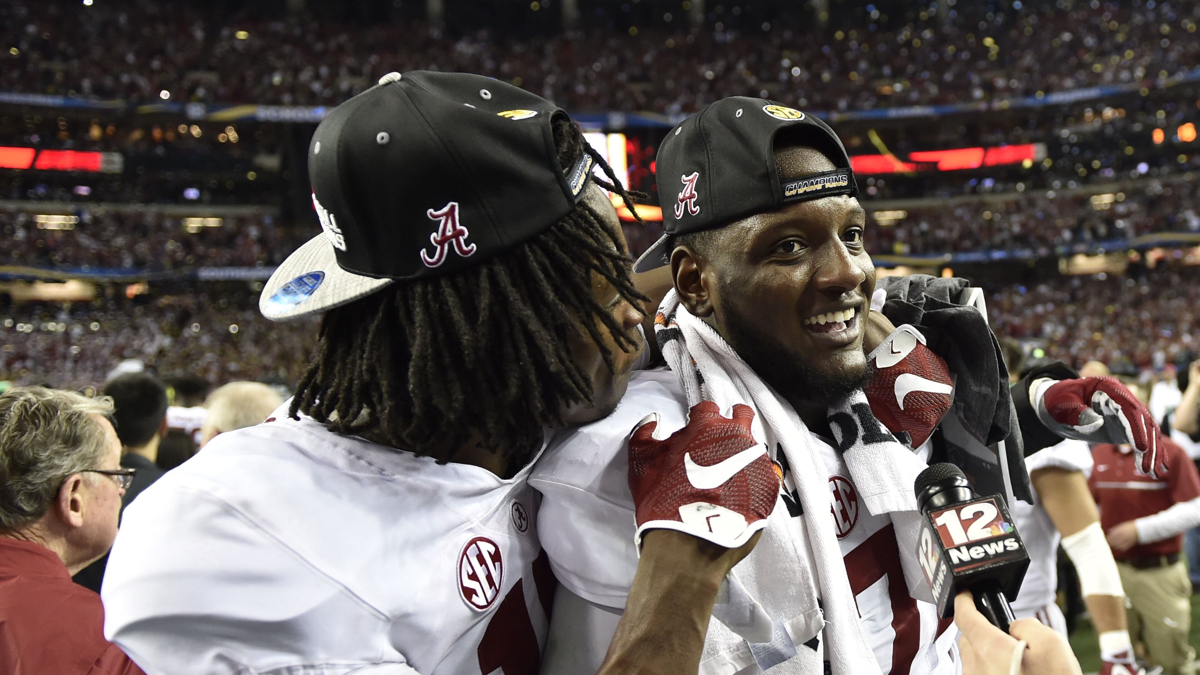 December 3, 2016, Atlanta - Alabama offensive lineman Cam Robinson (74) and Alabama wide receiver Cam Sims (17) celebrate after the SEC Championship Game between the Alabama Crimson Tide and the Florida Gators in Atlanta, Georgia, on Saturday, December 3, 2016. Alabama defeated Florida 54-16. (DAVID BARNES / DAVID.BARNES@AJC.COM)