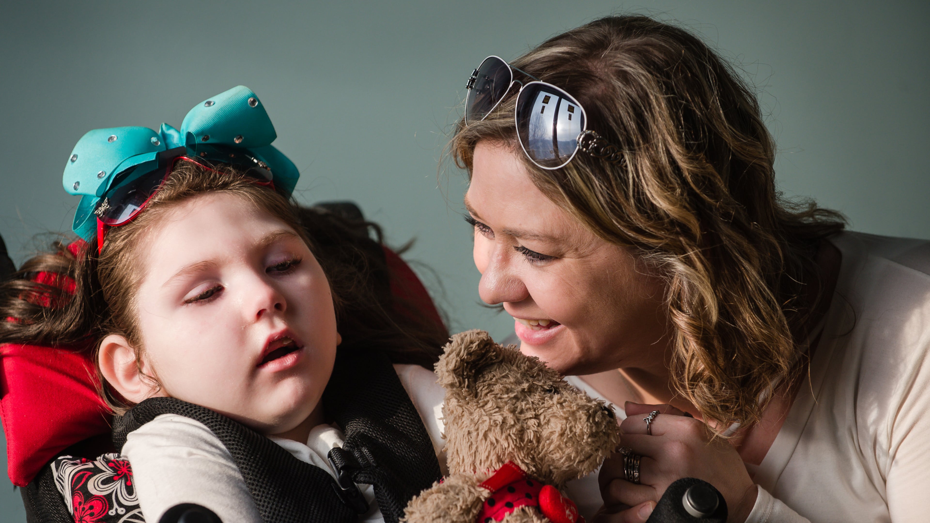 Janea Cox talks with daughter Haleigh, 7, as they visit their home under construction in Forsyth. The Coxes are temporarily living at a relative's home while they rebuild their own home, which burned down in July 2015.