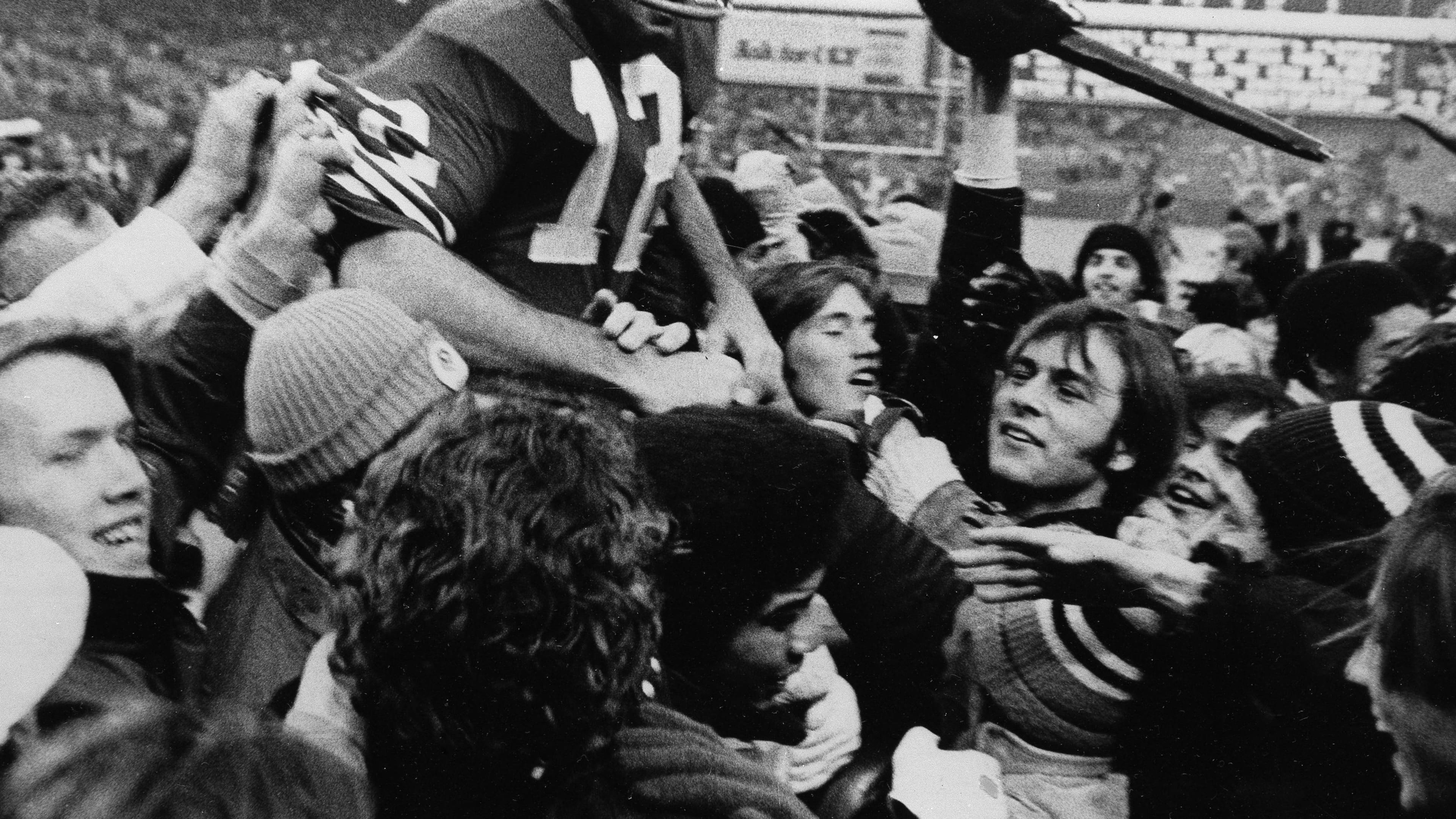 FILE - John Brodie, veteran San Francisco 49ers quarterback, gets a free ride on the shoulders of an admiring crowd following their win over the Minnesota Vikings that gave the 49ers the Western Division championship in San Francisco, Dec. 16, 1972. (AP Photo, File)