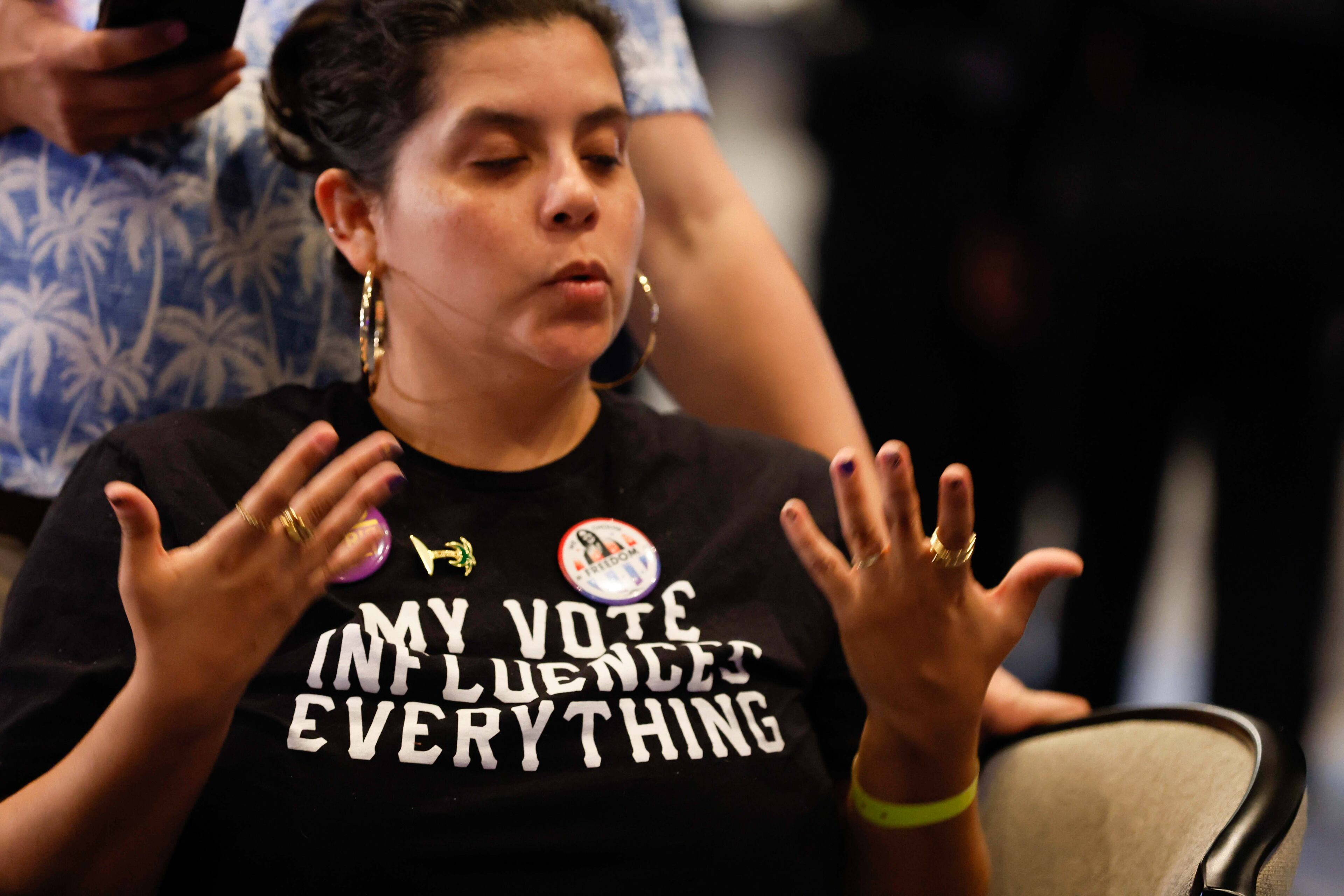 Julia Ahumada, a supporter of Kamala Harris, practices breathing exercises to relax during the Democratic election night watch party at the Hyatt Regency Hotel in downtown Atlanta on Tuesday, November 5, 2024.
(Miguel Martinez / AJC)