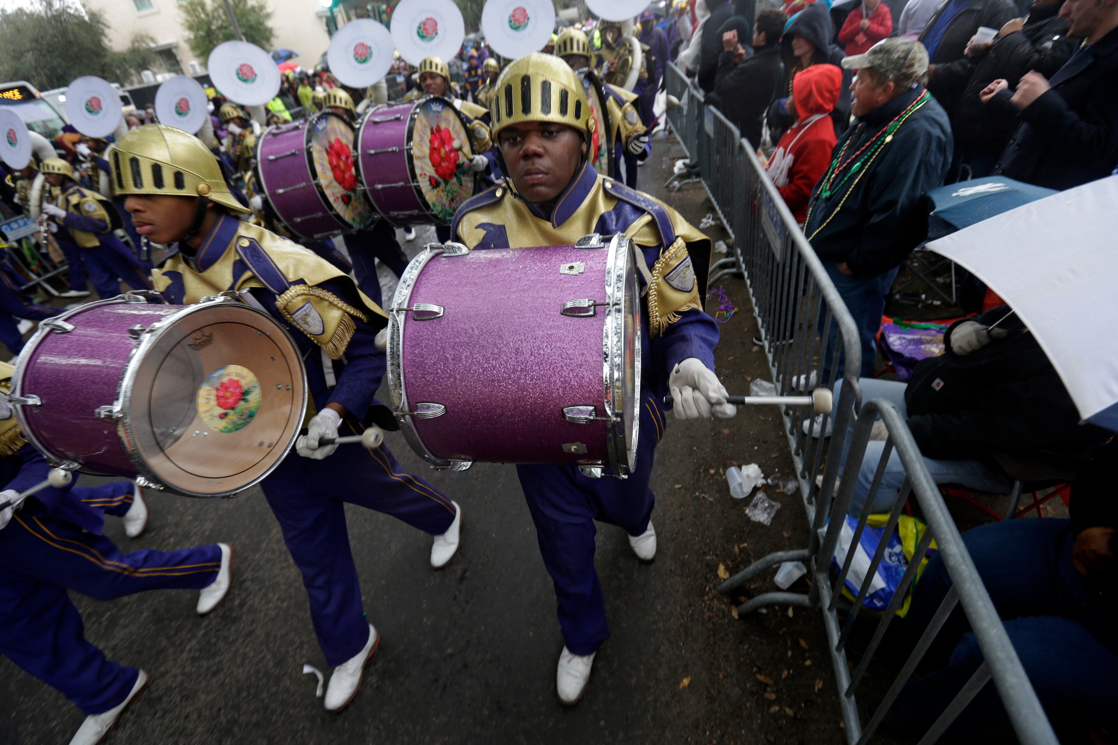Members of the St. Augustine High Marching 100 band march in the Krewe of Zulu parade during Mardi Gras day in New Orleans, Tuesday, March 4, 2014. (AP Photo/Gerald Herbert)