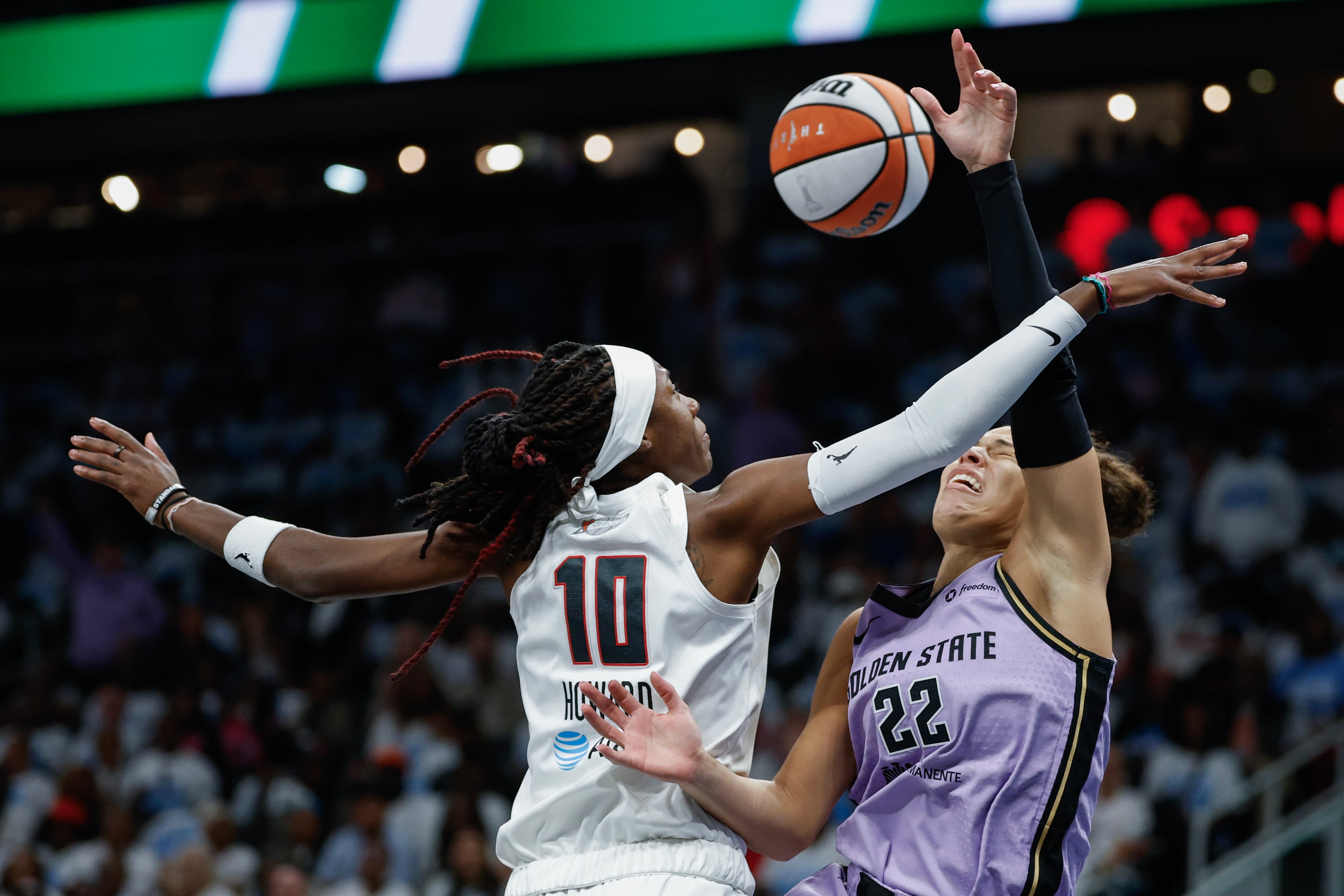 Golden State Valkyries guard Veronica Burton (right) is defended by Atlanta Dream guard Rhyne Howard during the first half of Game 4 of the WNBA Finals between the Atlanta Dream and the Golden State Valkyries, Saturday, Oct. 24, 2026, in Atlanta. (Erik S. Lesser for the AJC)