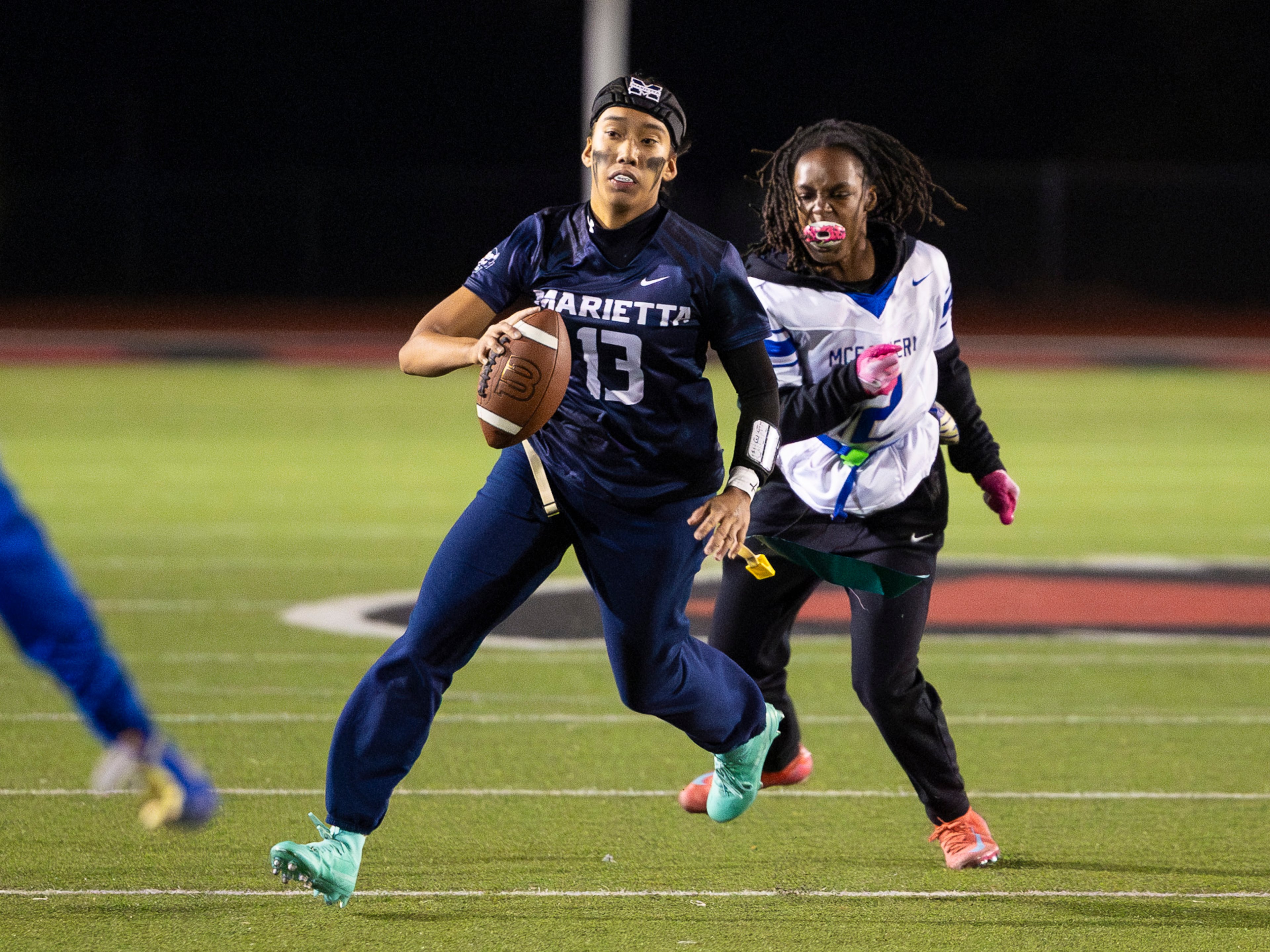 Marietta's Kaylee Wang (13) runs with the ball in a flag football game against McEachern at Osborne High School in Marietta, GA on Monday, November 17th, 2025. (Oscar Guevara Saenz for the AJC)