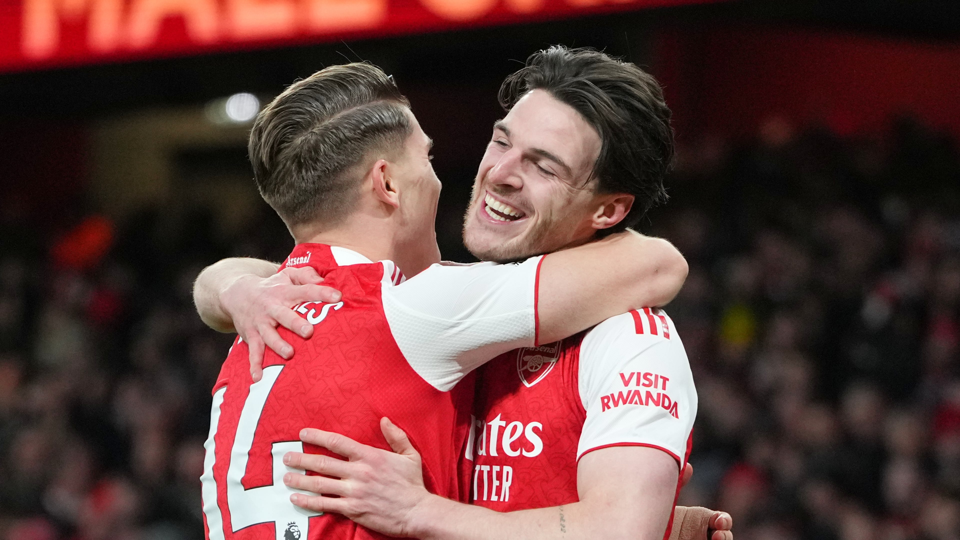Arsenal's Viktor Gyoekeres and Arsenal's Declan Rice celebrate after Brighton's Georginio Rutter scored an own goal during the English Premier League soccer match between Arsenal and Brighton and Hove Albion in London, Saturday, Dec. 27, 2025. (AP Photo/Kirsty Wigglesworth)