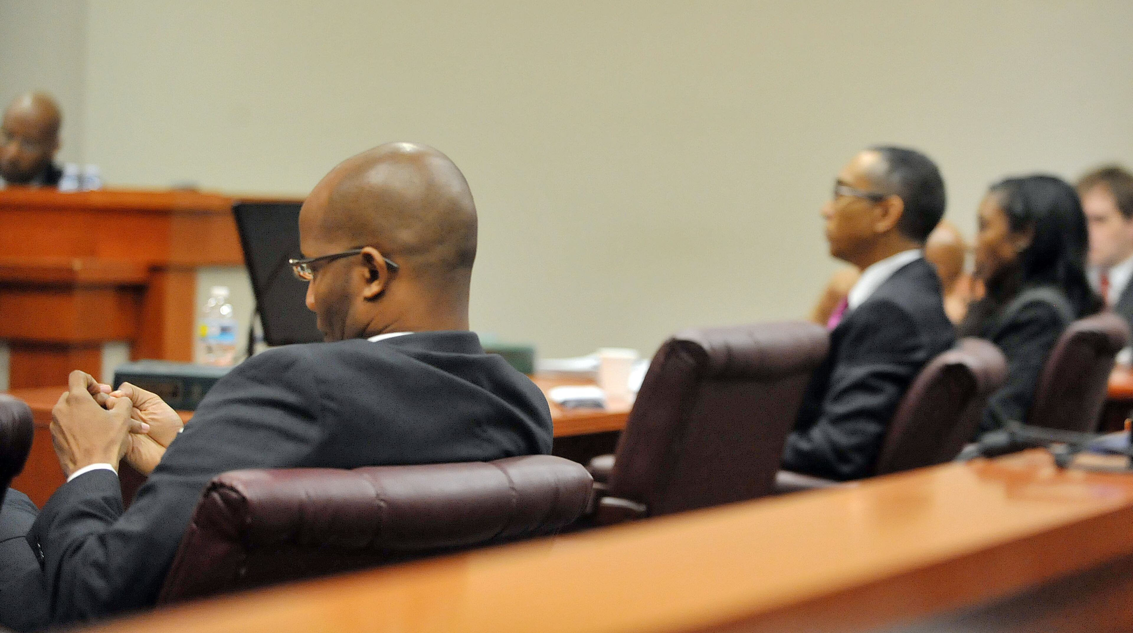 JULY81, 2015 DECATUR DeKalb County District Attorney Robert James (left) listens to defense attorney Craig Gillen make a statement on behalf of embattled DeKalb County CEO Burrell Ellis. Ellis was sentenced to serve 18 months in prison Wednesday July 8, 2015. Ellis was found guilty of attempted extortion and perjury a week ago in his retrial before Superior Court Judge Courtney Johnson. KENT D. JOHNSON /KDJOHNSON@AJC.COM