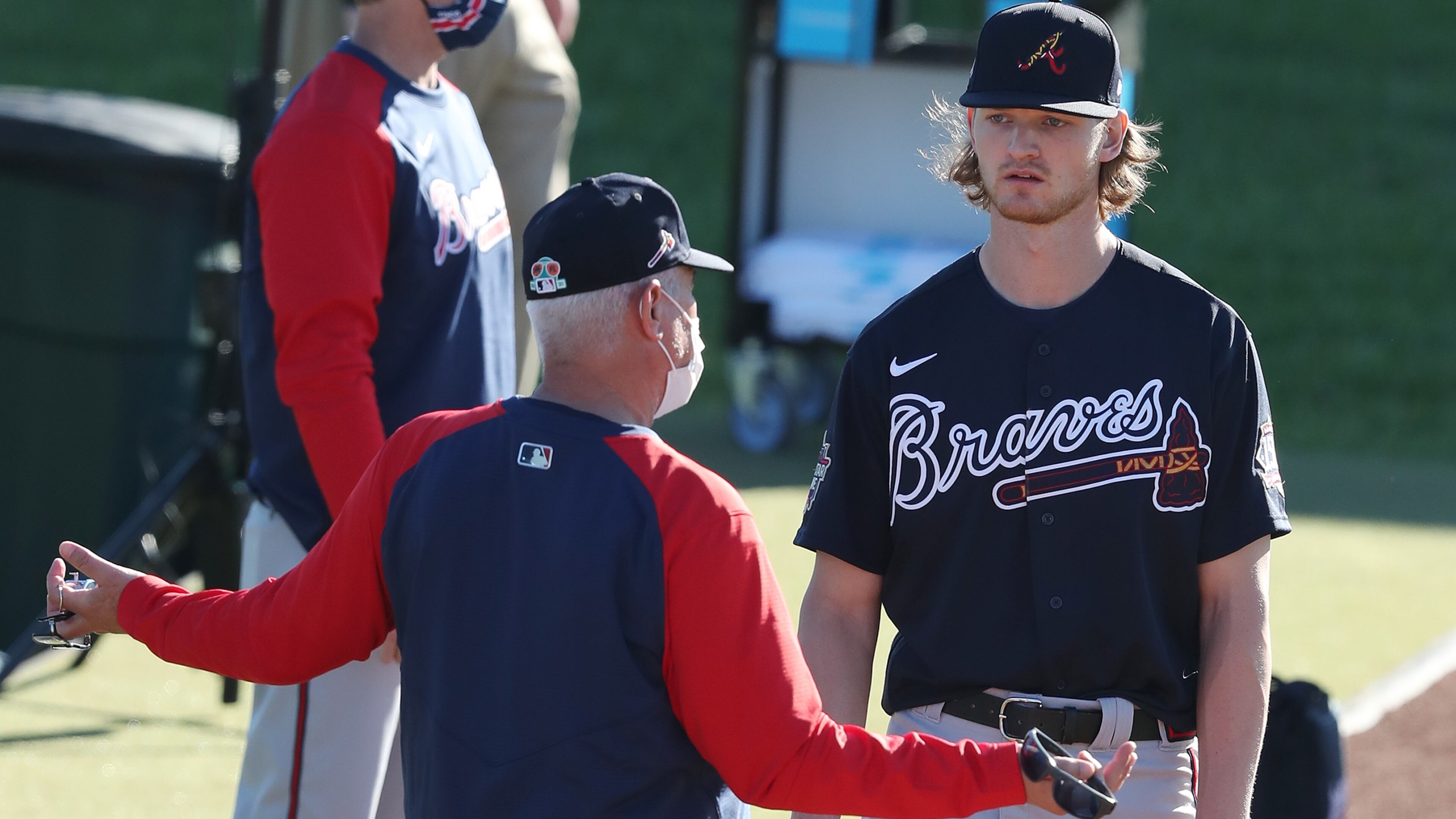 Braves pitching coach Rick Kranitz confers with right-hander Mike Soroka, coming back from a torn right Achilles tendon, during his morning pitching session at spring training on Thursday, Feb. 25, 2021, in North Port. Curtis Compton / Curtis.Compton@ajc.com”