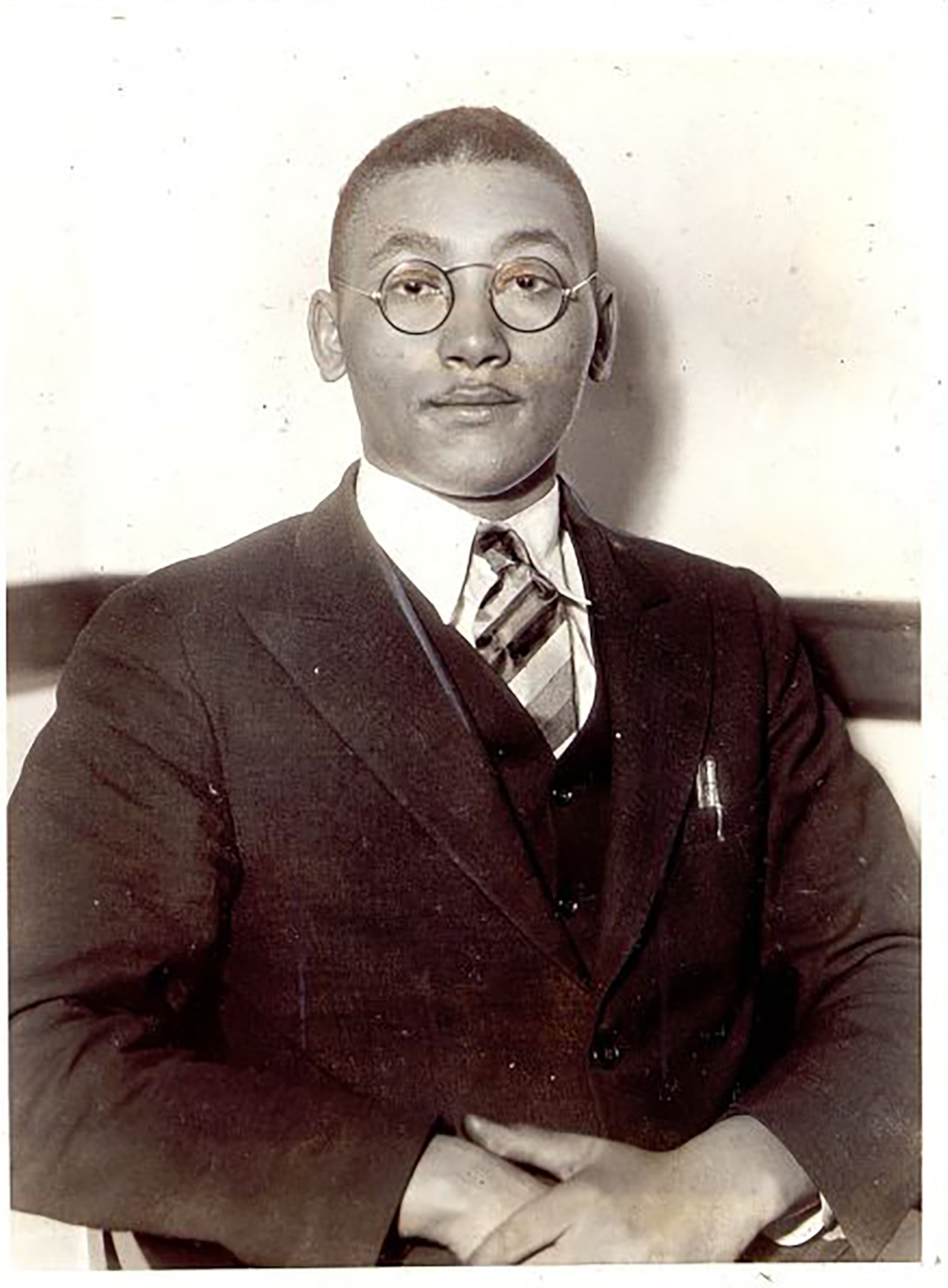 Angelo Herndon, 19, is shown in court in 1933, just before he was sentenced. He had come South with a message of Communism, but was convicted in Atlanta under a statute passed 60 years ago. He was sentenced to 18 to 20 years in prison. The jury found Herndon guilty after deliberating more than two hours, and recommended mercy. (Associated Press 1933 photo)