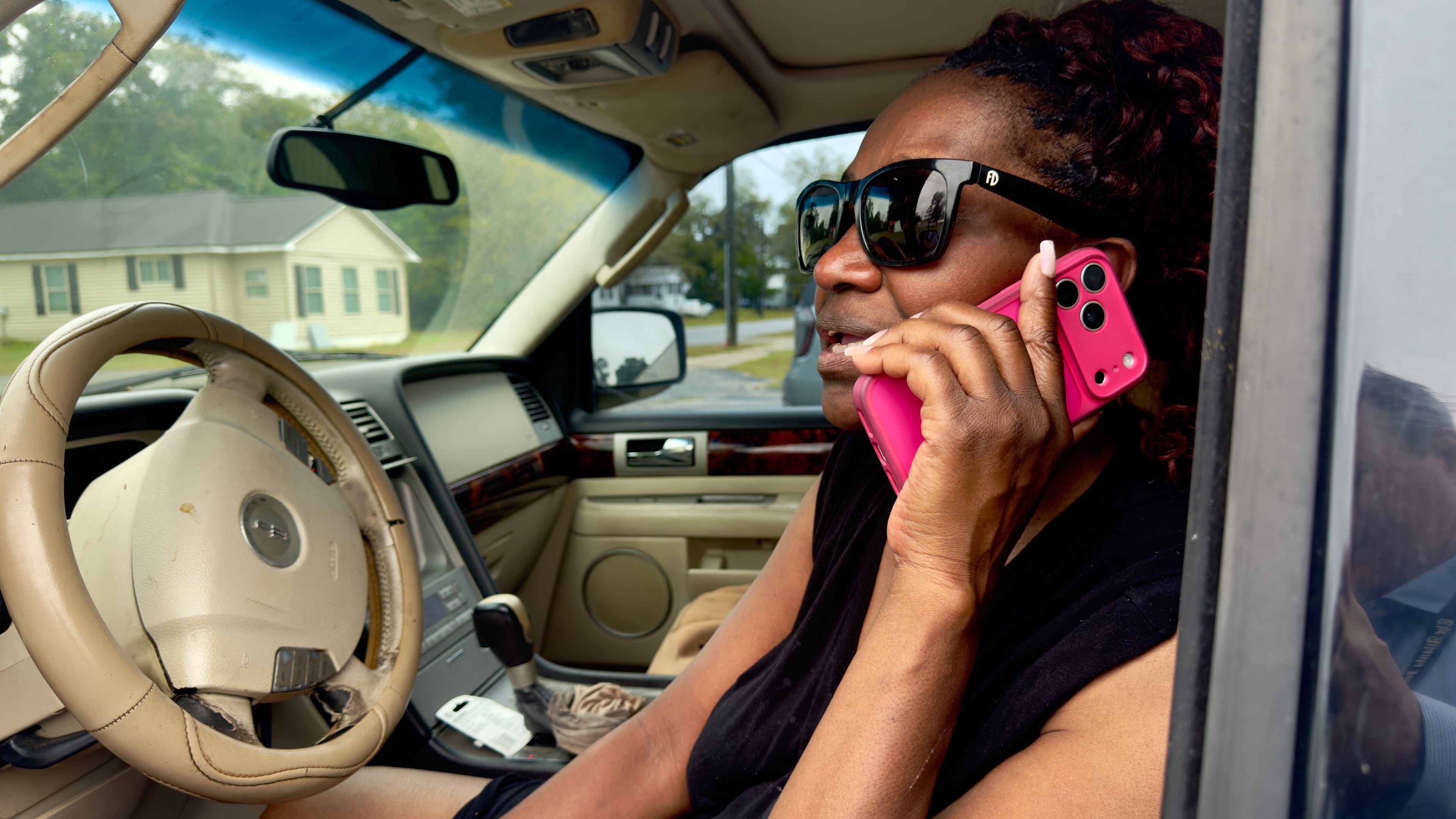 Lisa Bryant in her SUV along West Pine Street on Monday morning, not far from her home where, nearby early Sunday, two people were killed and 35 were injured in a shooting in Vienna, Georgia. Joe Kovac/AJC)