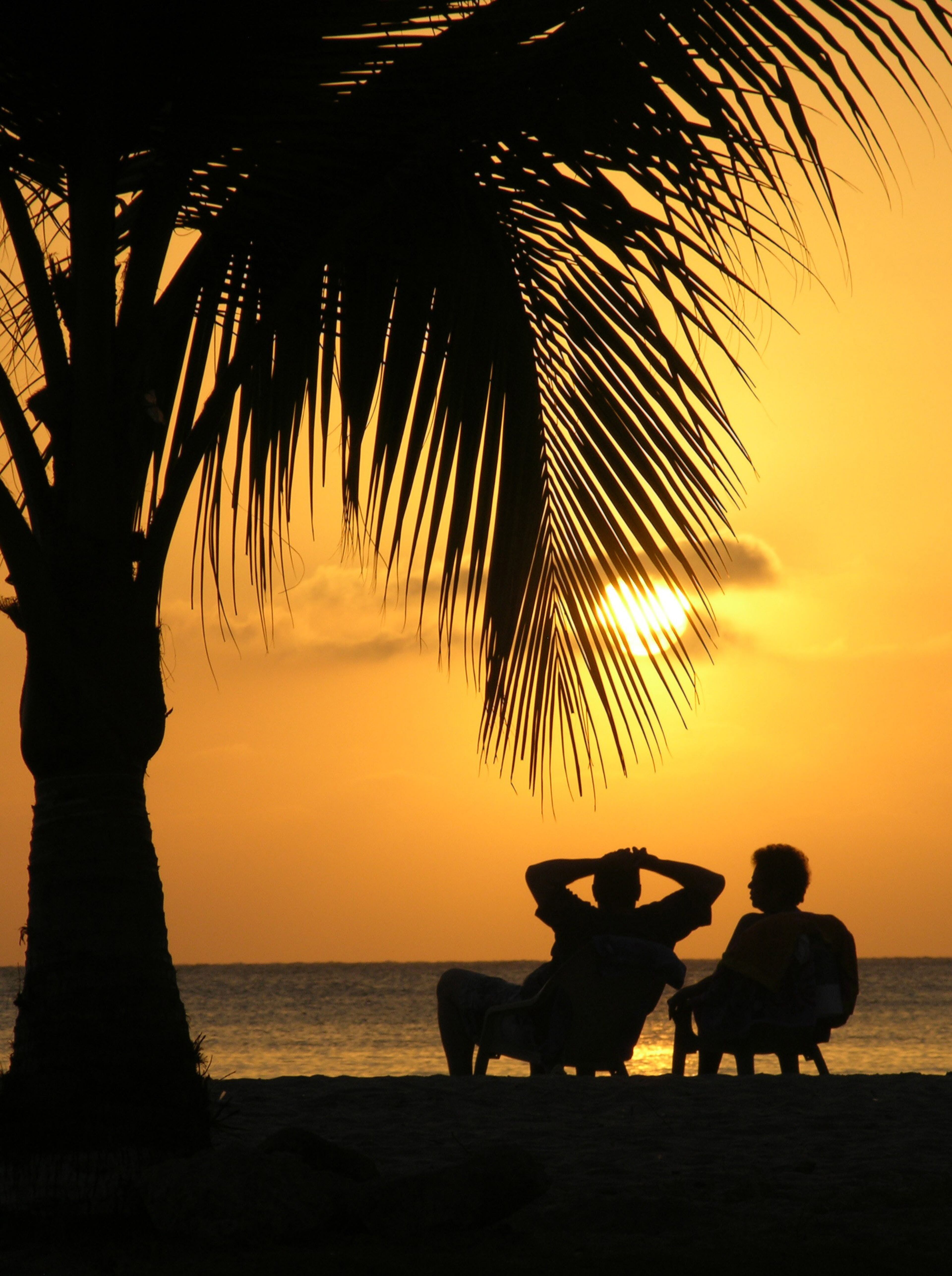 Travelzoo's second pick, Colombia, is discarding an "infamous past" and emerging as a popular tourist destination. Several airlines and hotel chains are expanding in the area – and all that competition means great deals for travelers. Here, tourists relax and enjoy the sunset on a beach in the Caribbean city of Cartagena.