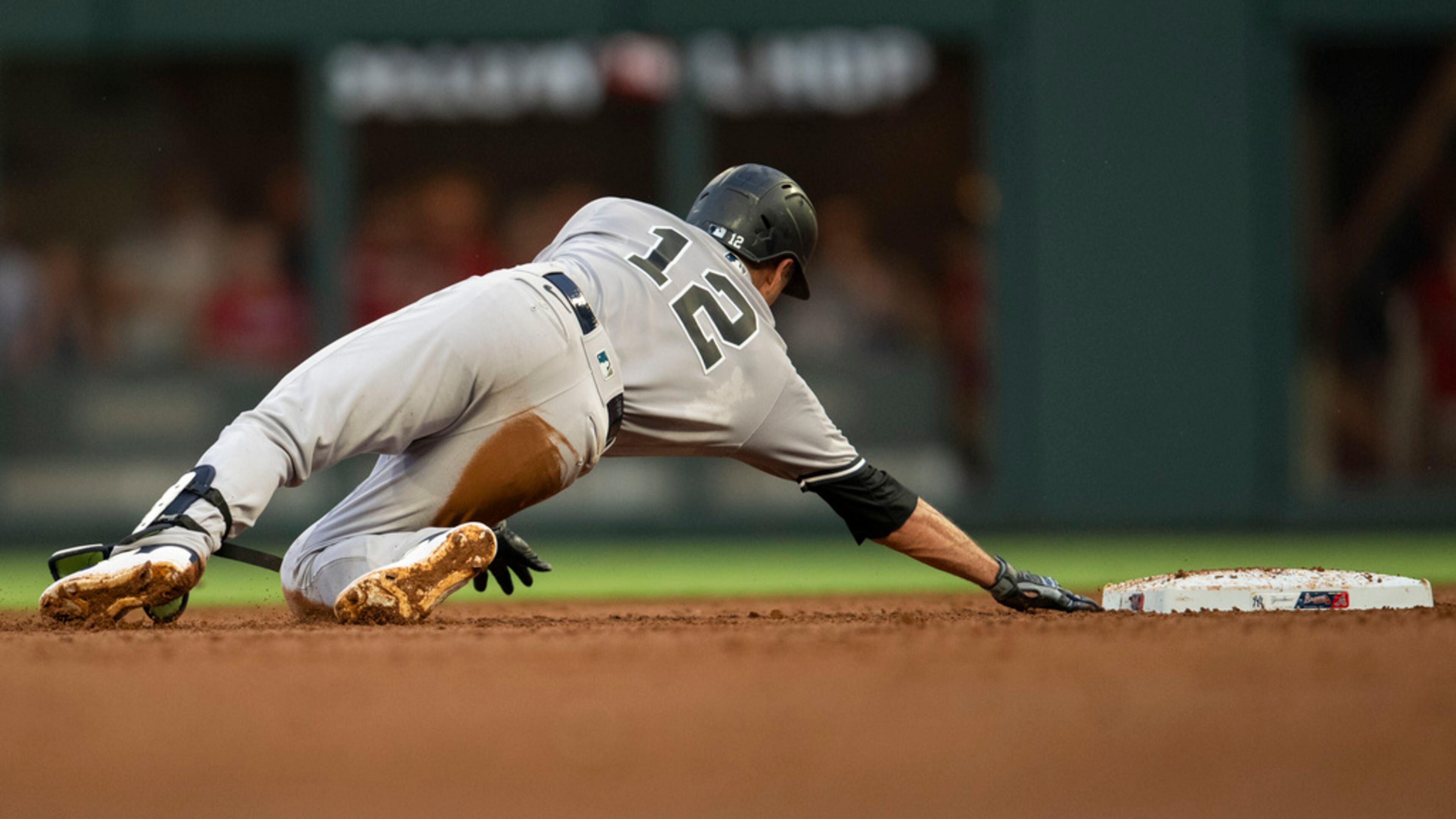 New York Yankees' Isiah Kiner-Falefa slides pass second base in the first inning of a baseball game against the Atlanta Braves, Monday, Aug. 14, 2023, in Atlanta. (AP Photo/Hakim Wright Sr.)