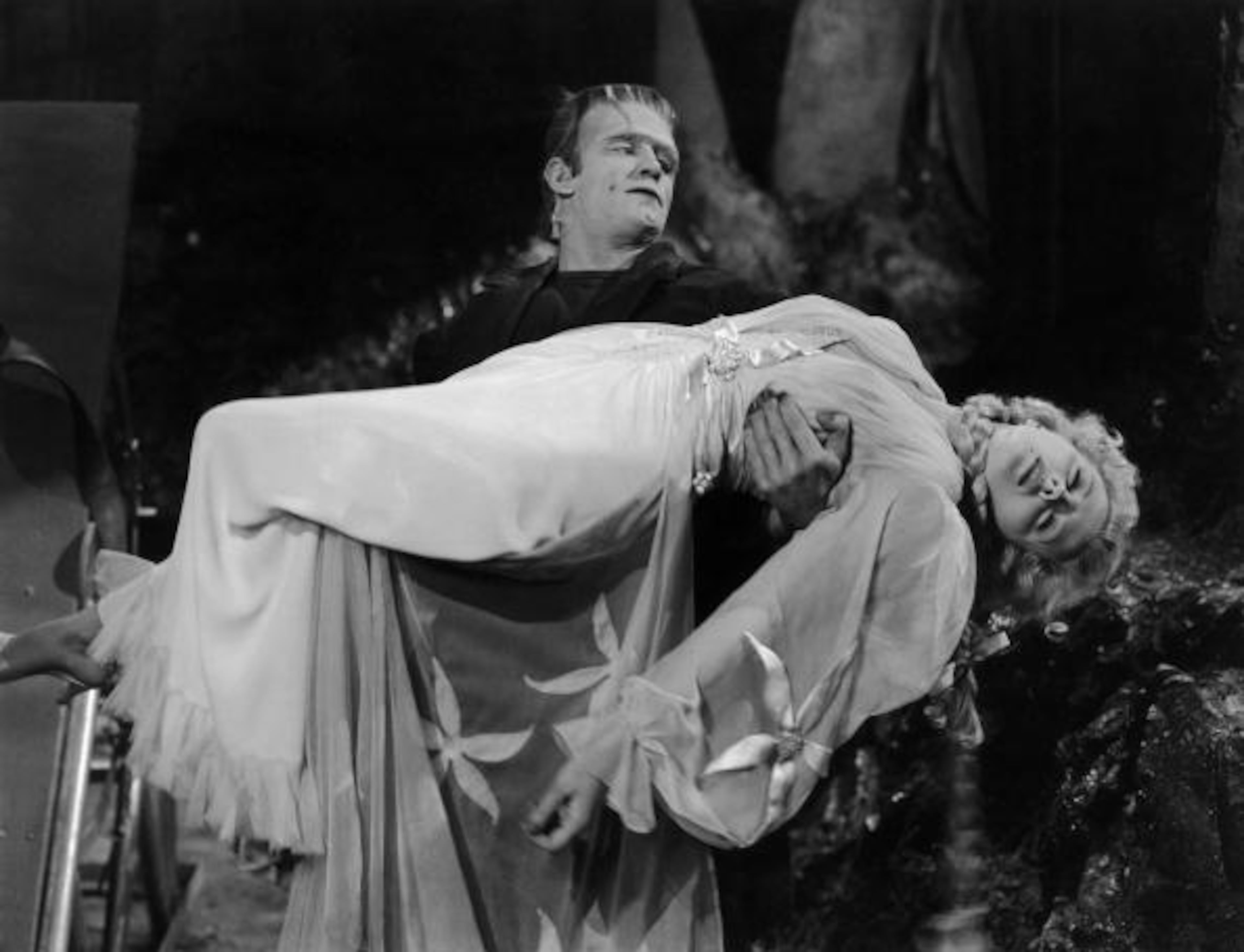 Frankenstein's monster, played by Bela Lugosi (1882 - 1956), carries Baroness Elsa Frankenstein, played by Ilona Massey (1910 - 1974), in a scene from 'Frankenstein Meets the Wolf Man', directed by Roy William Neill, 1943. (Photo by Universal Pictures/Hulton Archive/Getty Images)