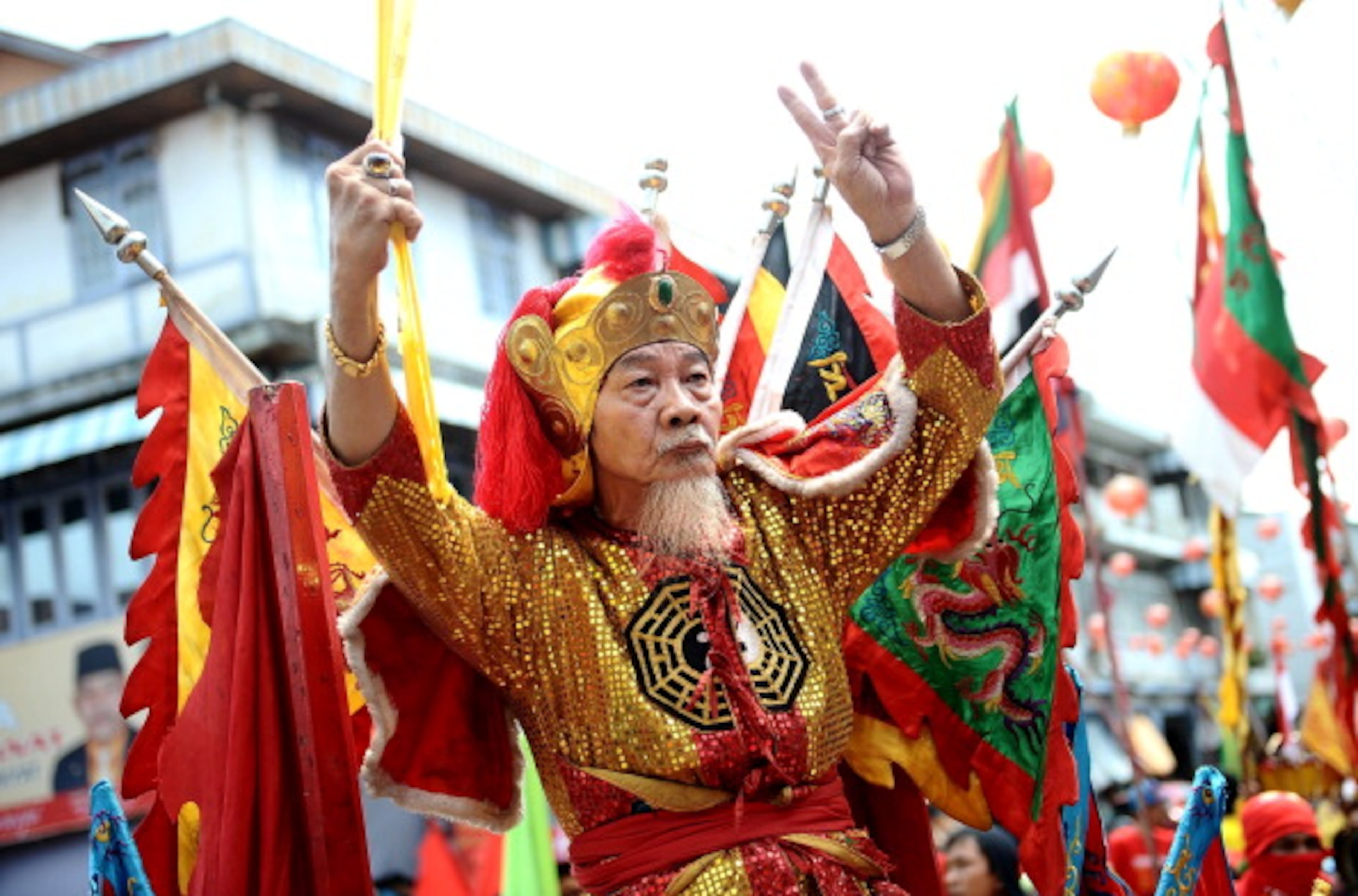 SINGKAWANG, KALIMANTAN, INDONESIA - FEBRUARY 14: A Tatung performs a ritual during Tatung Festival as part of Cap Go Meh celebration on February 14, 2014 in Singkawang, Kalimantan, Indonesia. The ancient art of Tatung, performed as part of the Cap Go Meh Festival, is believed to call upon positive spirit who help to dispel the bad spirits that may affect people's lives. Cap Go Meh Festival also know as Lantern Festival is celebrated in the 15th day of Chinese Lunar Year and marks the end of the Chinese New Year celebrations. (Photo by Robertus Pudyanto/Getty Images)