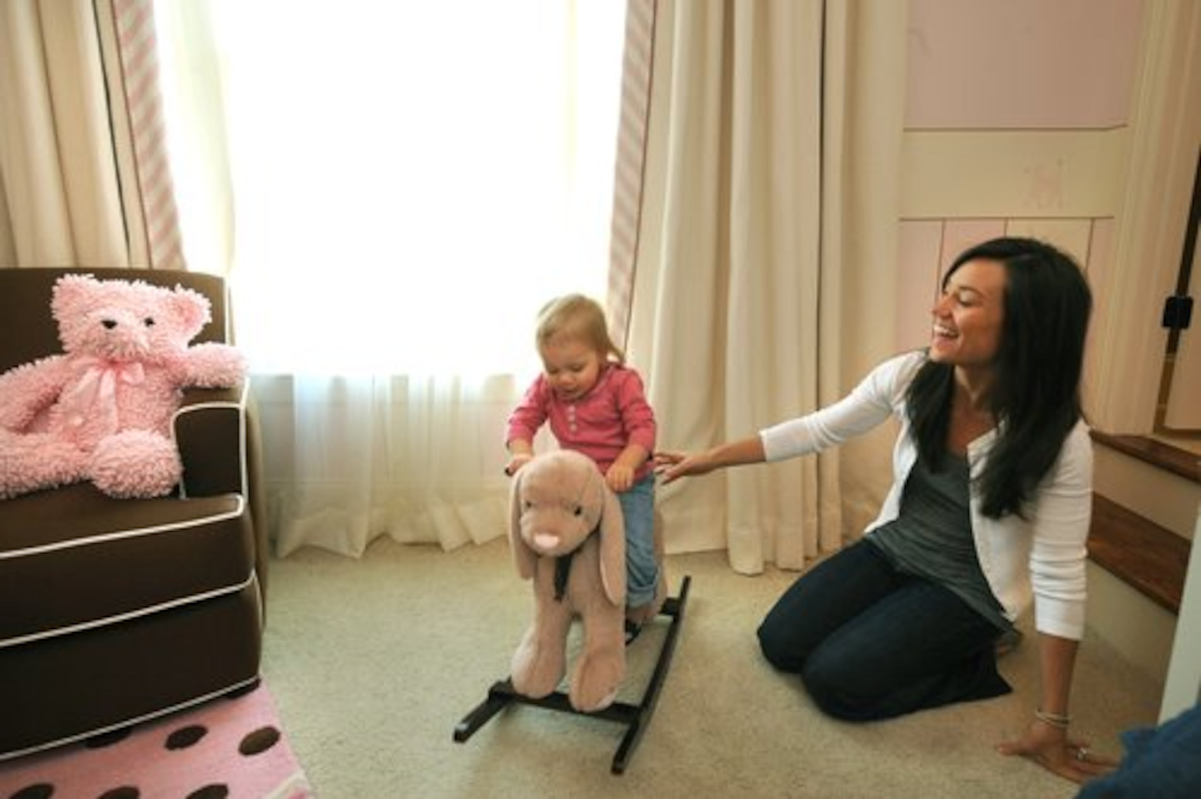 The 1-year-old loves her rocking bunny. Stella and Vicky travel with Heath 30 weeks out of the year.